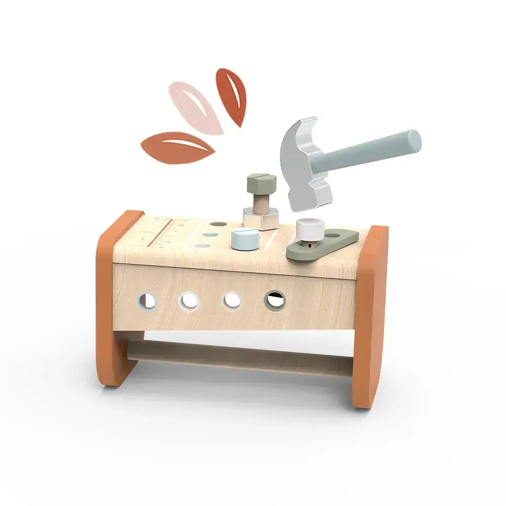 Wooden toy hammer bench with pegs and hammer hitting a bolt, children learning toy. Come see us at Awaken, Franklin, Tennessee