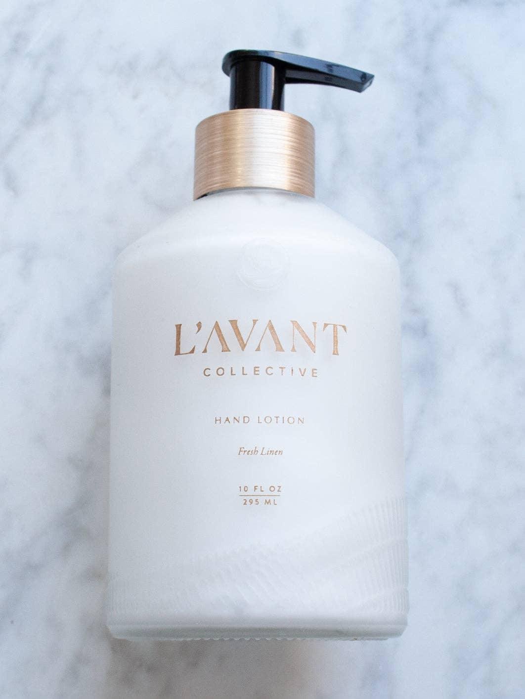 L'AVANT Collective fresh linen hand lotion on marble surface. Come see us at Awaken, Franklin, Tennessee.