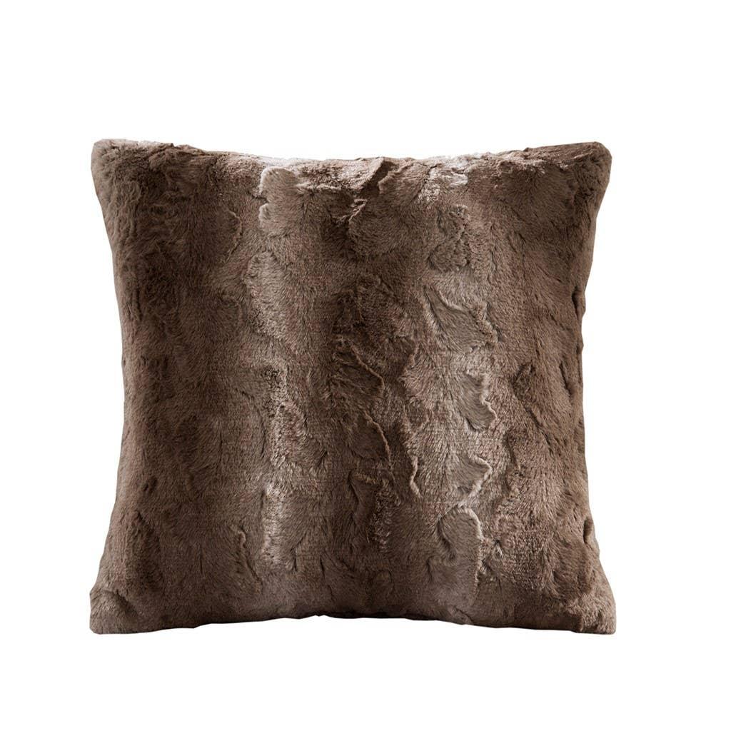 Soft brown faux fur throw pillow with textured pattern, cozy home decor. Come see us at Awaken, Franklin, Tennessee