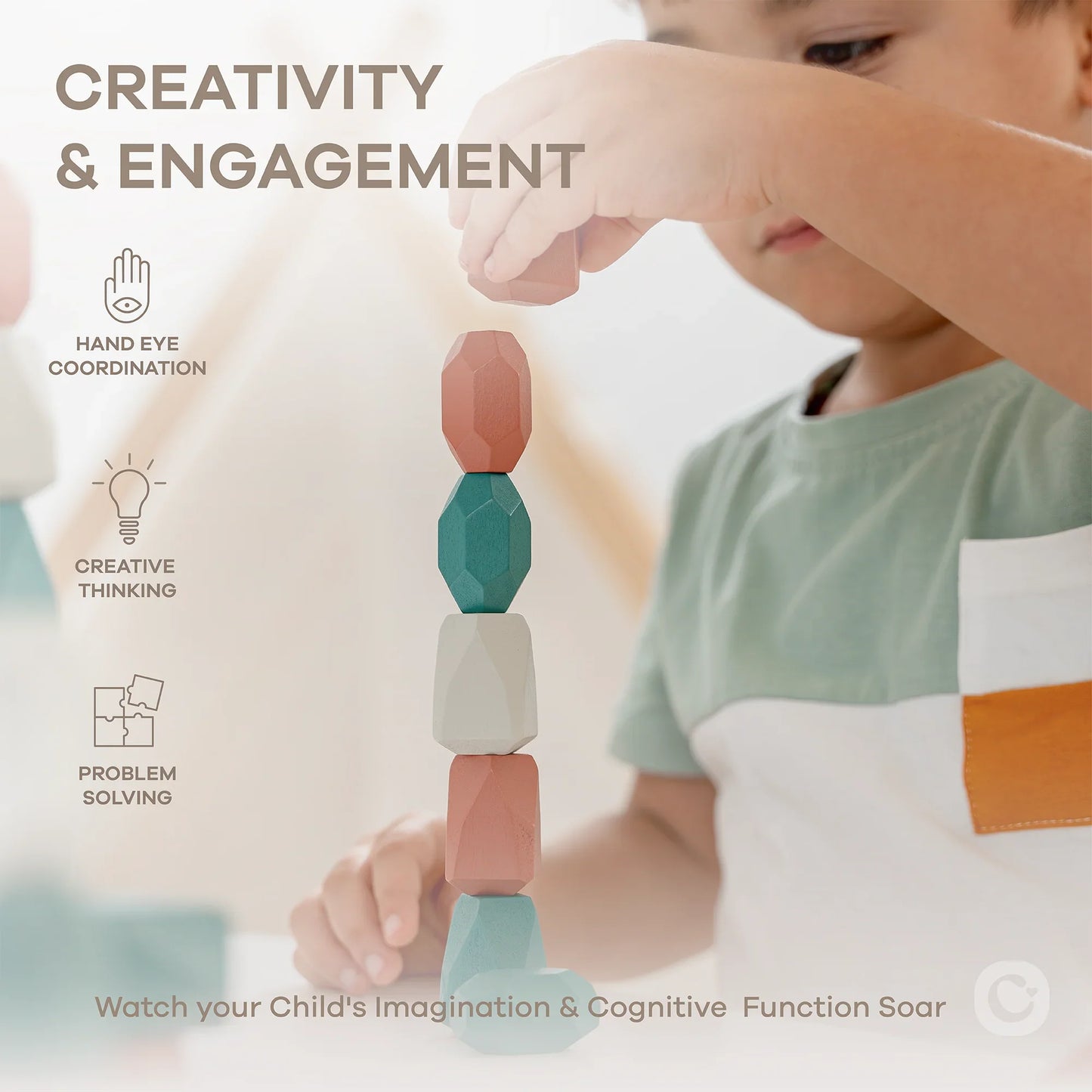 Child stacking colorful wooden blocks focusing on creativity, hand eye coordination, and problem solving. Come see us at Awaken, Franklin, Tennessee