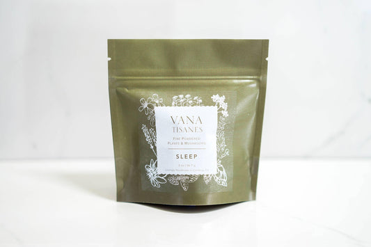 Vana Tisanes Sleep herbal powder pouch with botanical design on white surface, Come see us at Awaken, Franklin, Tennessee