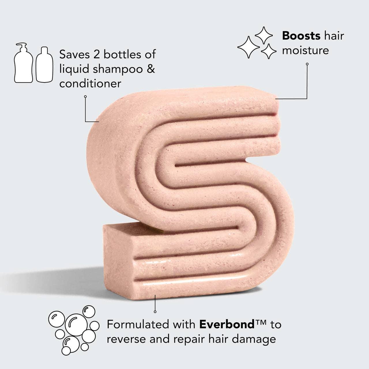 Pink solid shampoo shaped like number 5, saves bottles, boosts hair moisture, with Everbond repair. Come see us at Awaken, Franklin, Tennessee