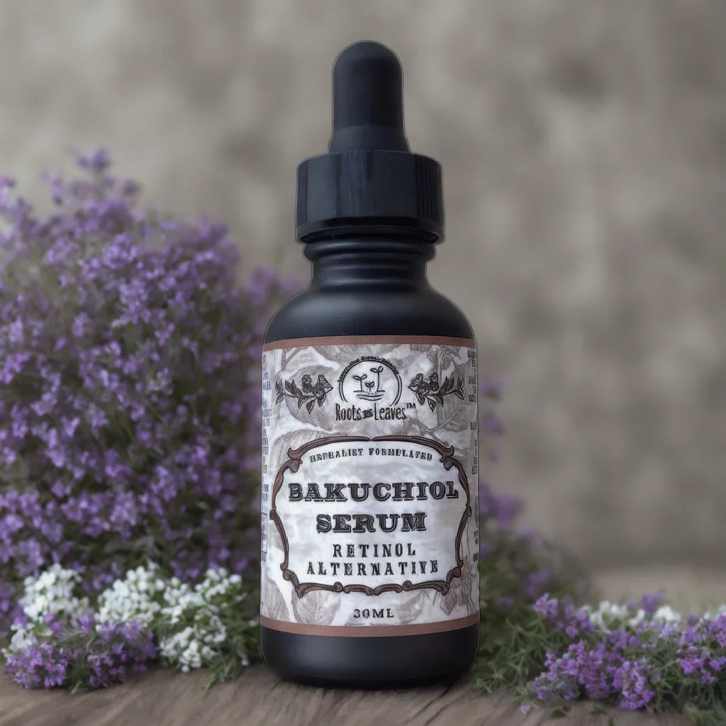 Bakuchiol Serum bottle labeled retinol alternative with purple flowers background. Come see us at Awaken, Franklin, Tennessee