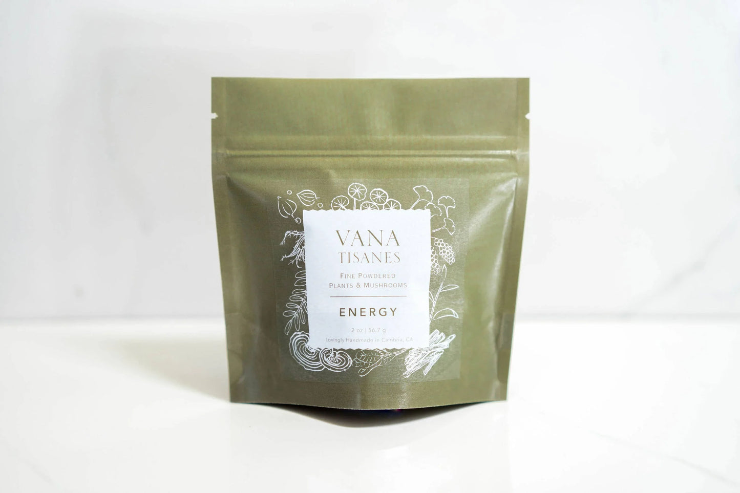 Vana Tisanes Energy powdered plants and mushrooms pouch on white surface. Come see us at Awaken, Franklin, Tennessee