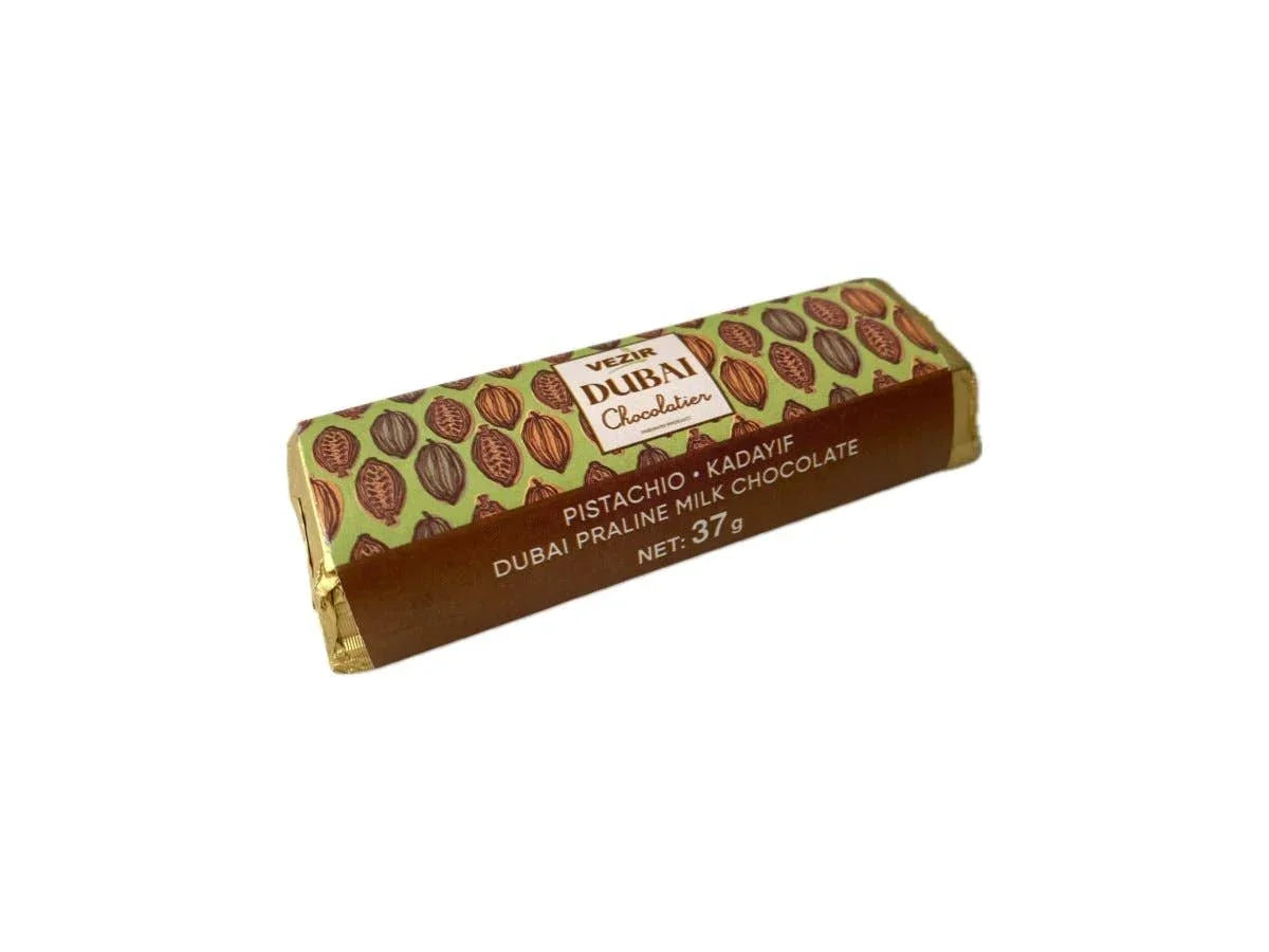 Dubai Chocolatier pistachio kadayif milk chocolate bar with green and brown packaging, 37g. Come see us at Awaken, Franklin, Tennessee