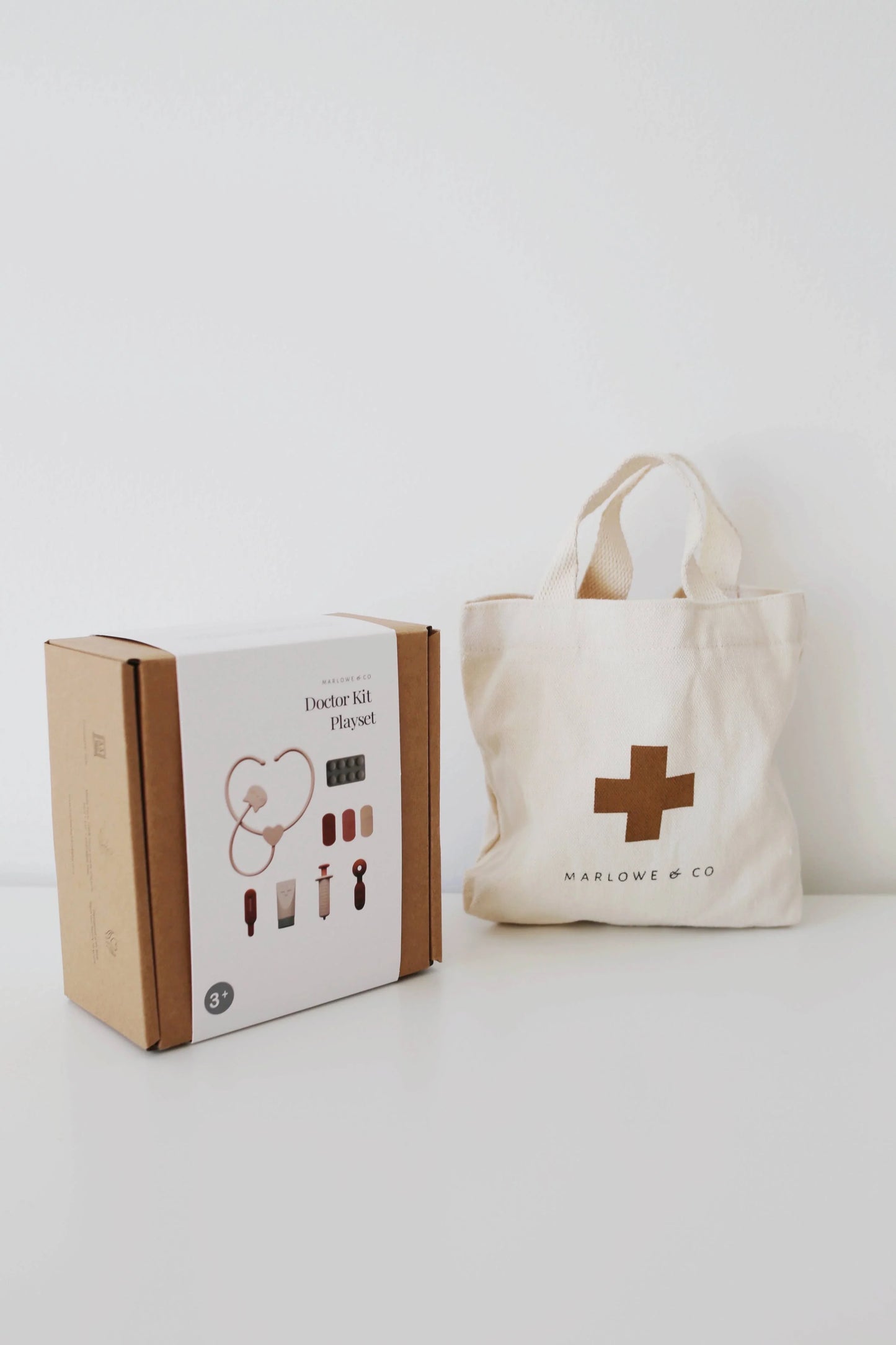 Marlowe & Co Doctor Kit Playset with beige medical bag on white table, minimal design. Come see us at Awaken, Franklin, Tennessee