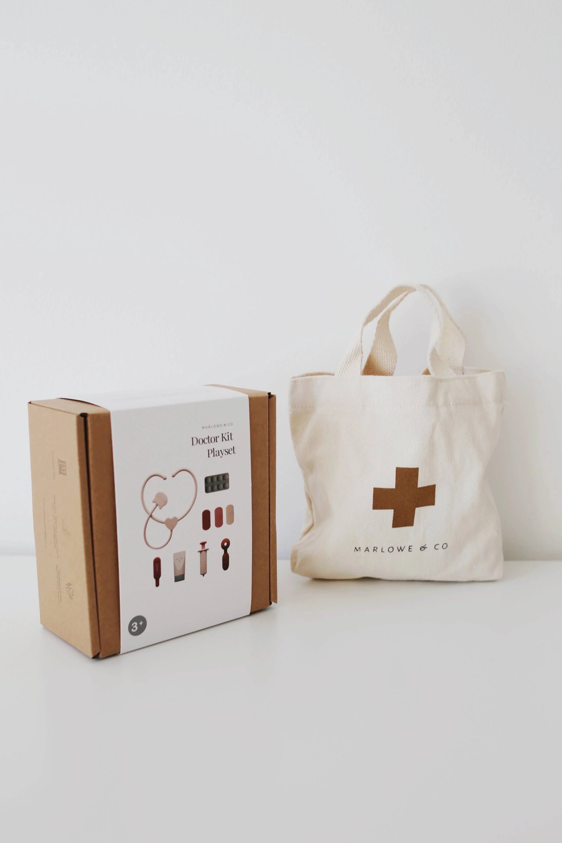 Marlowe & Co Doctor Kit Playset with beige medical bag on white table, minimal design. Come see us at Awaken, Franklin, Tennessee