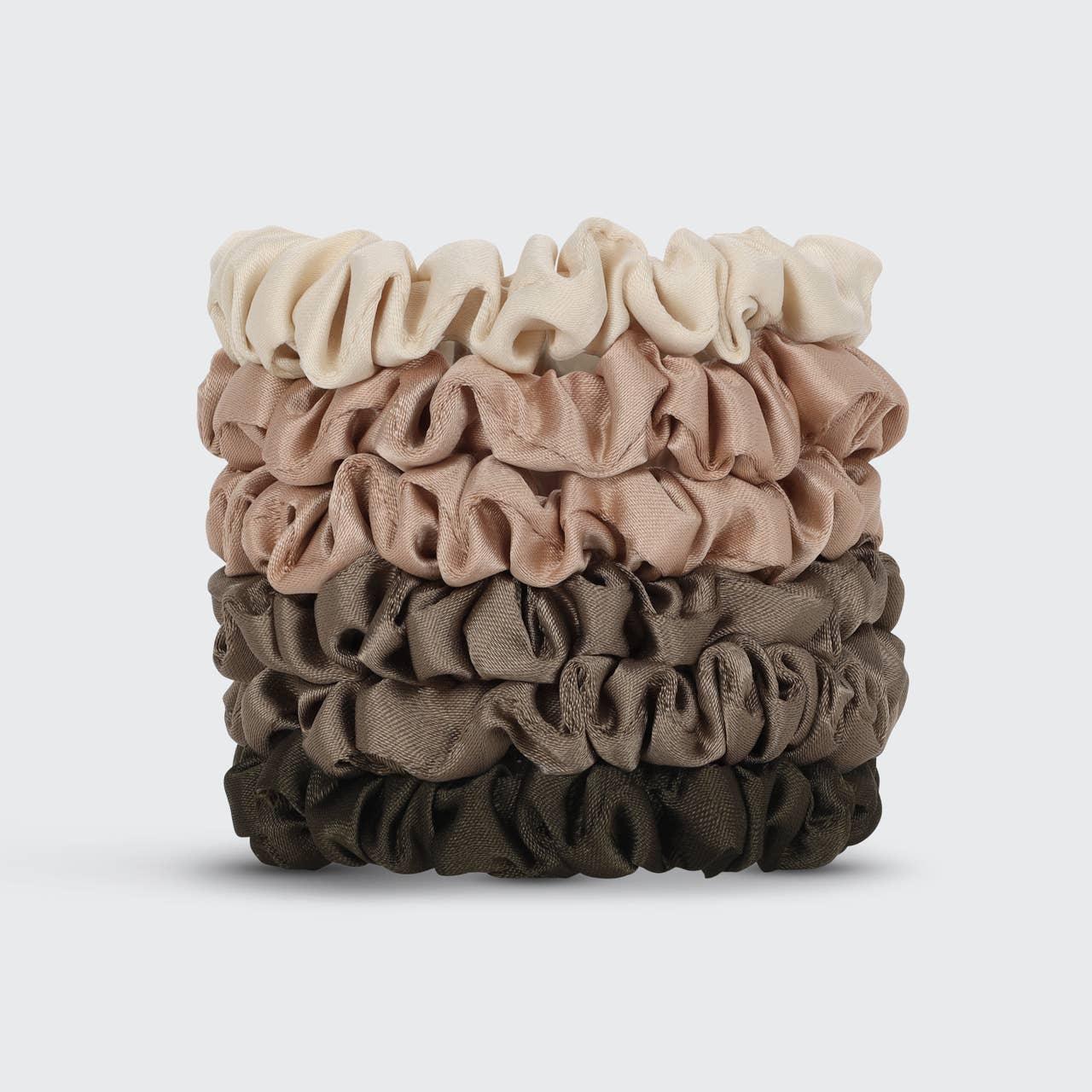 Stack of five satin scrunchies in neutral tones on light background. Come see us at Awaken, Franklin, Tennessee