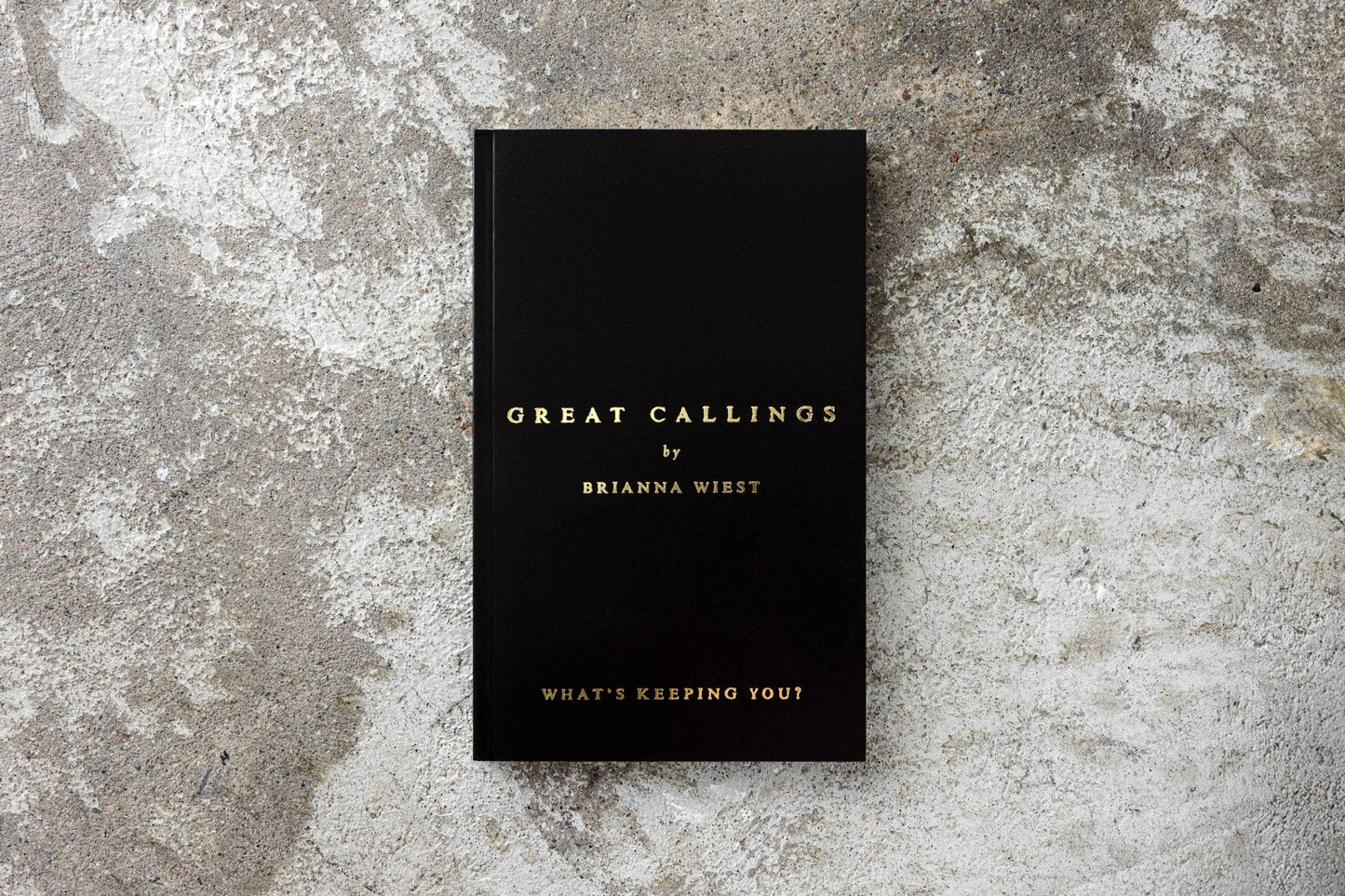 Black book titled Great Callings by Brianna Wiest on concrete background, Come see us at Awaken, Franklin, Tennessee