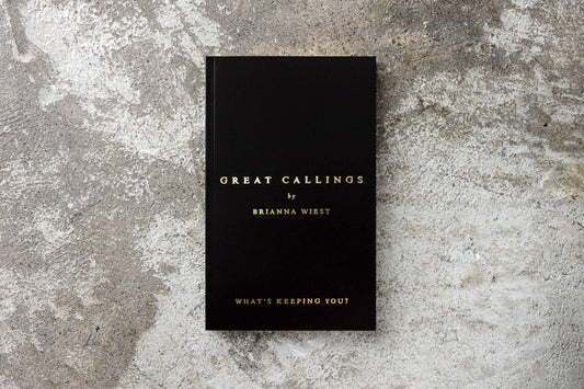 Black book titled Great Callings by Brianna Wiest on concrete background, Come see us at Awaken, Franklin, Tennessee