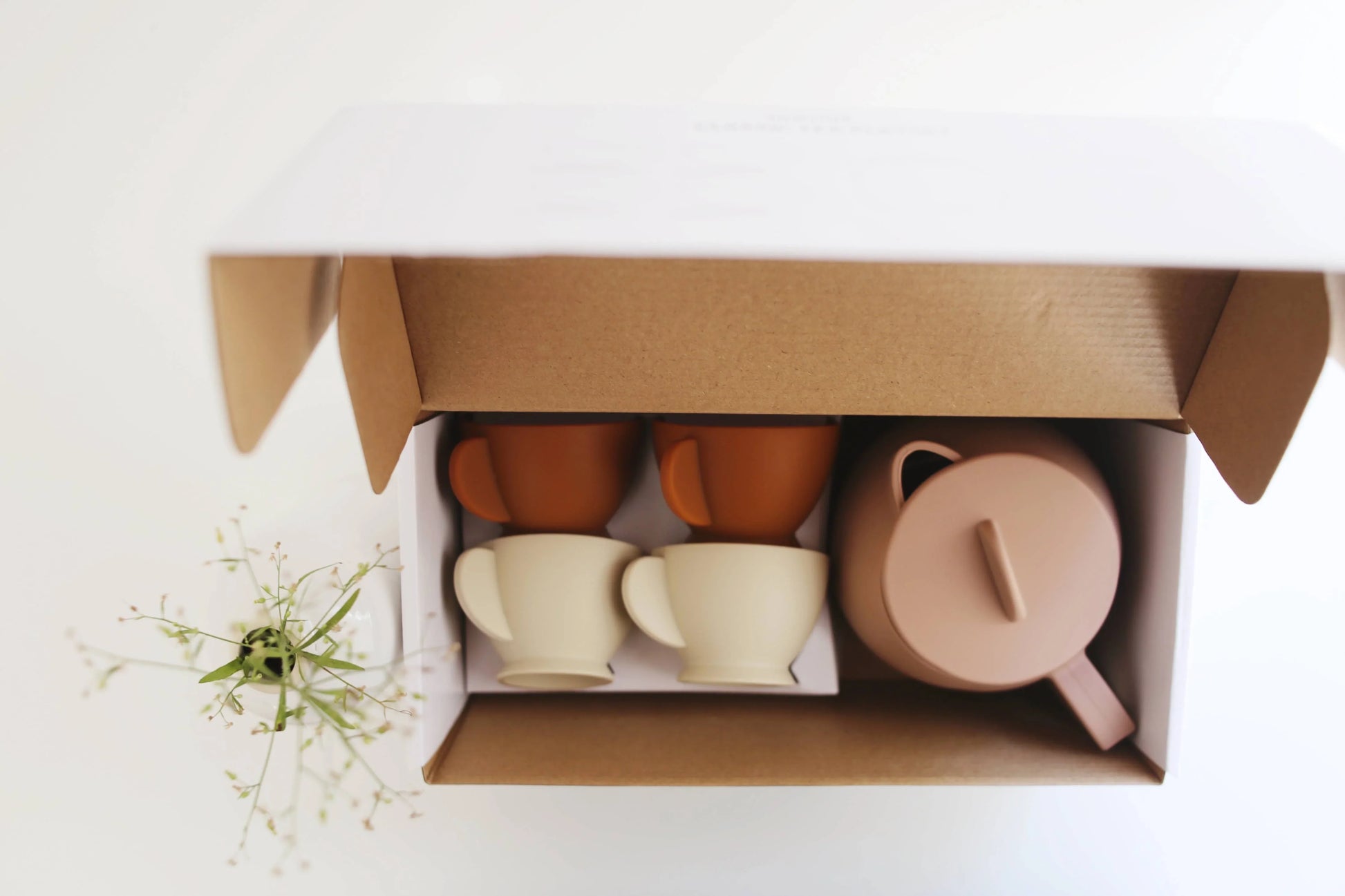 Minimalist ceramic tea set in box with four cups and teapot. Come see us at Awaken, Franklin, Tennessee.