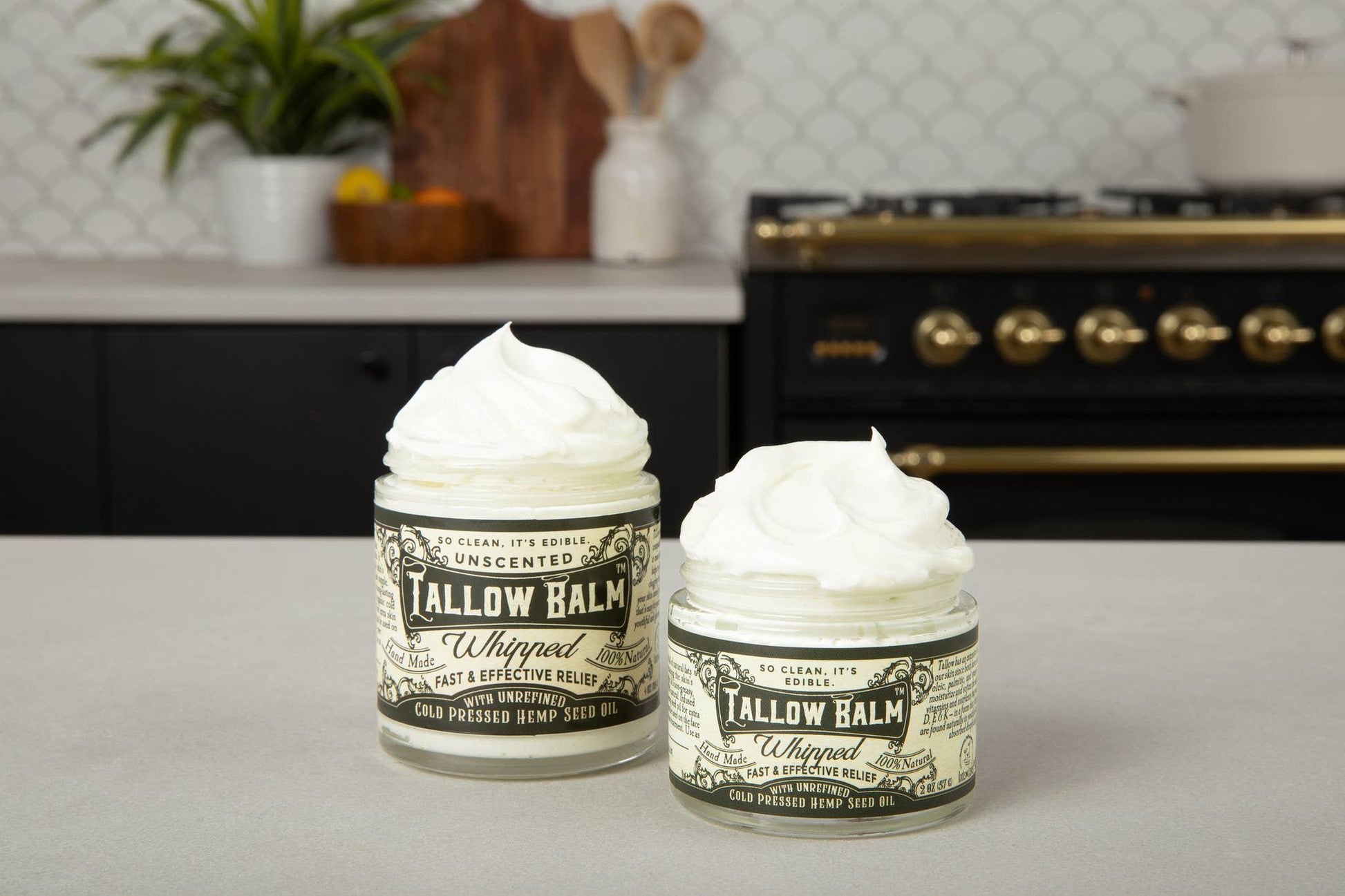 Two jars of unscented whipped Tallow Balm with cold pressed hemp seed oil on kitchen counter, Come see us at Awaken, Franklin, Tennessee