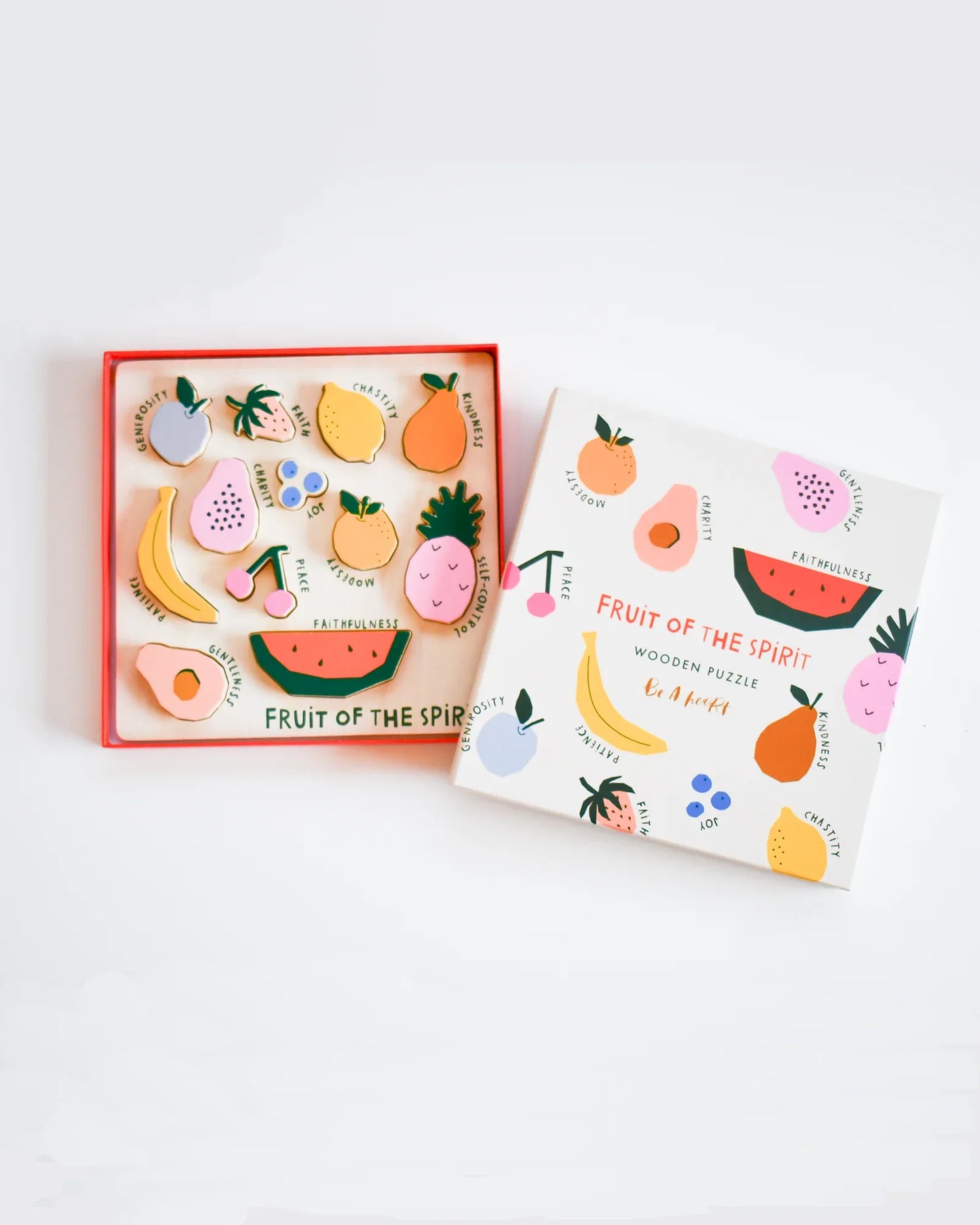 Fruit of the Spirit wooden puzzle with colorful fruit shapes and virtues labeled; Come see us at Awaken, Franklin, Tennessee