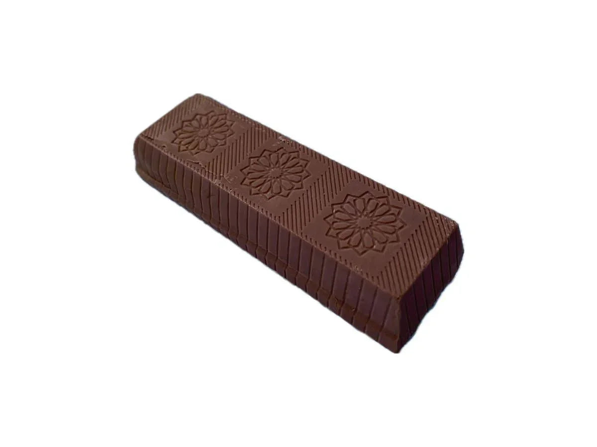 Chocolate bar with floral imprint on white background. Come see us at Awaken, Franklin, Tennessee