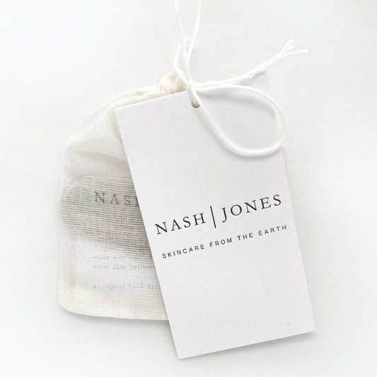 Nash Jones skincare tag on drawstring pouch, minimalist design, Come see us at Awaken, Franklin, Tennessee