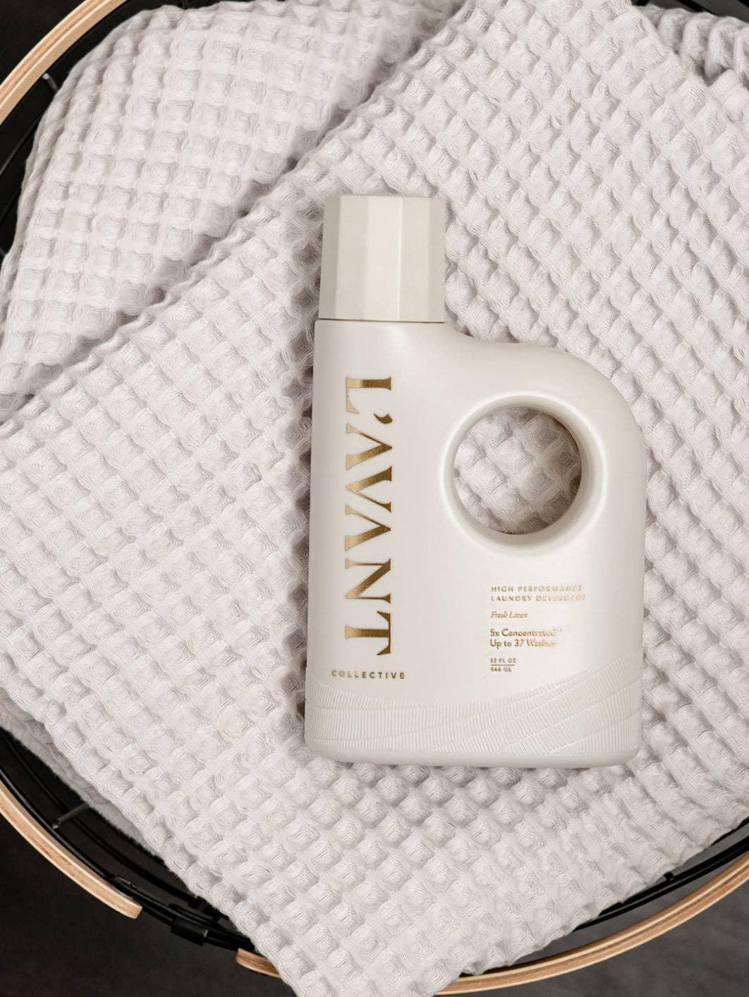 L'AVANT Collective laundry detergent on a white textured towel, Come see us at Awaken, Franklin, Tennessee