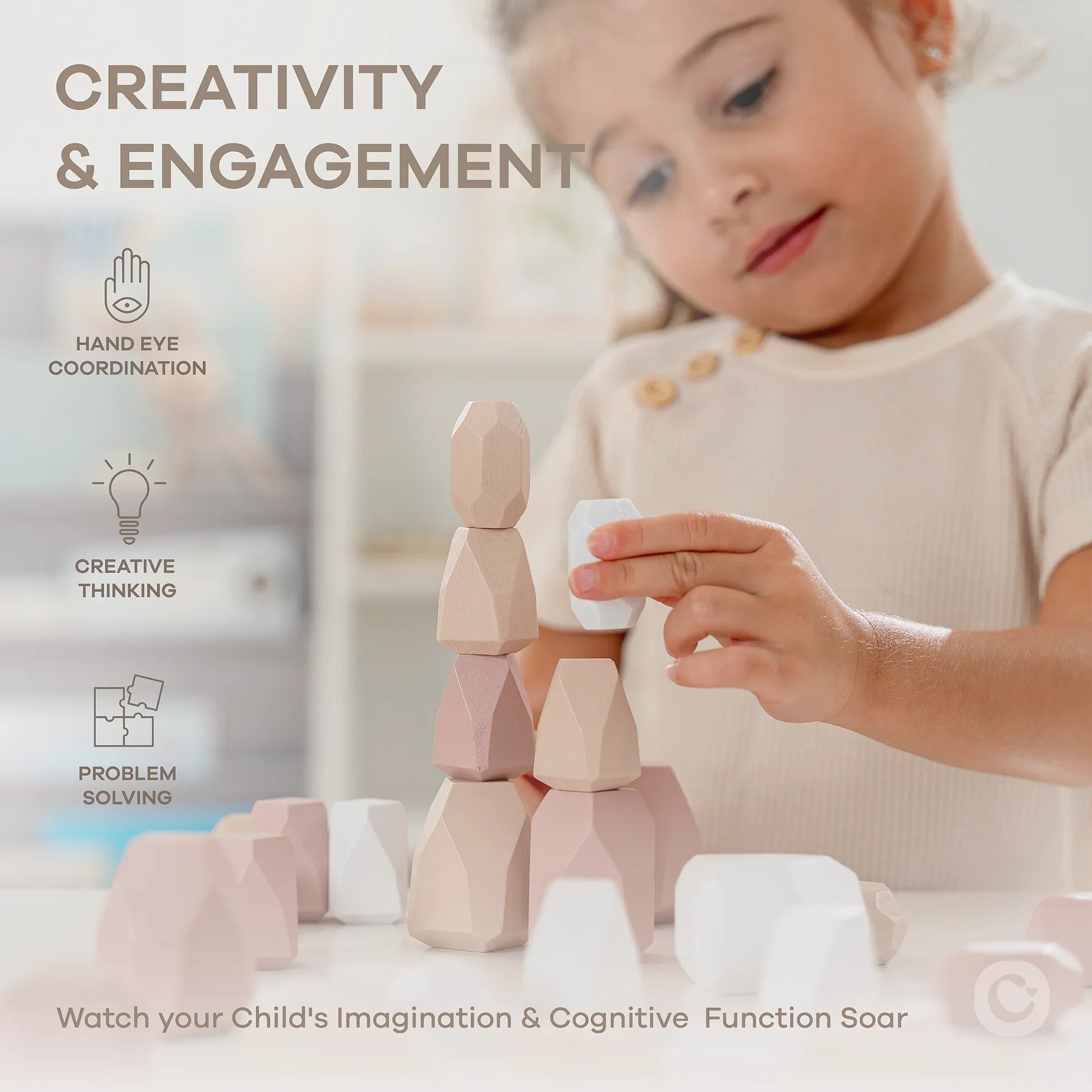 Child stacking pastel-colored geometric blocks indoors developing creativity and engagement. Come see us at Awaken, Franklin, Tennessee