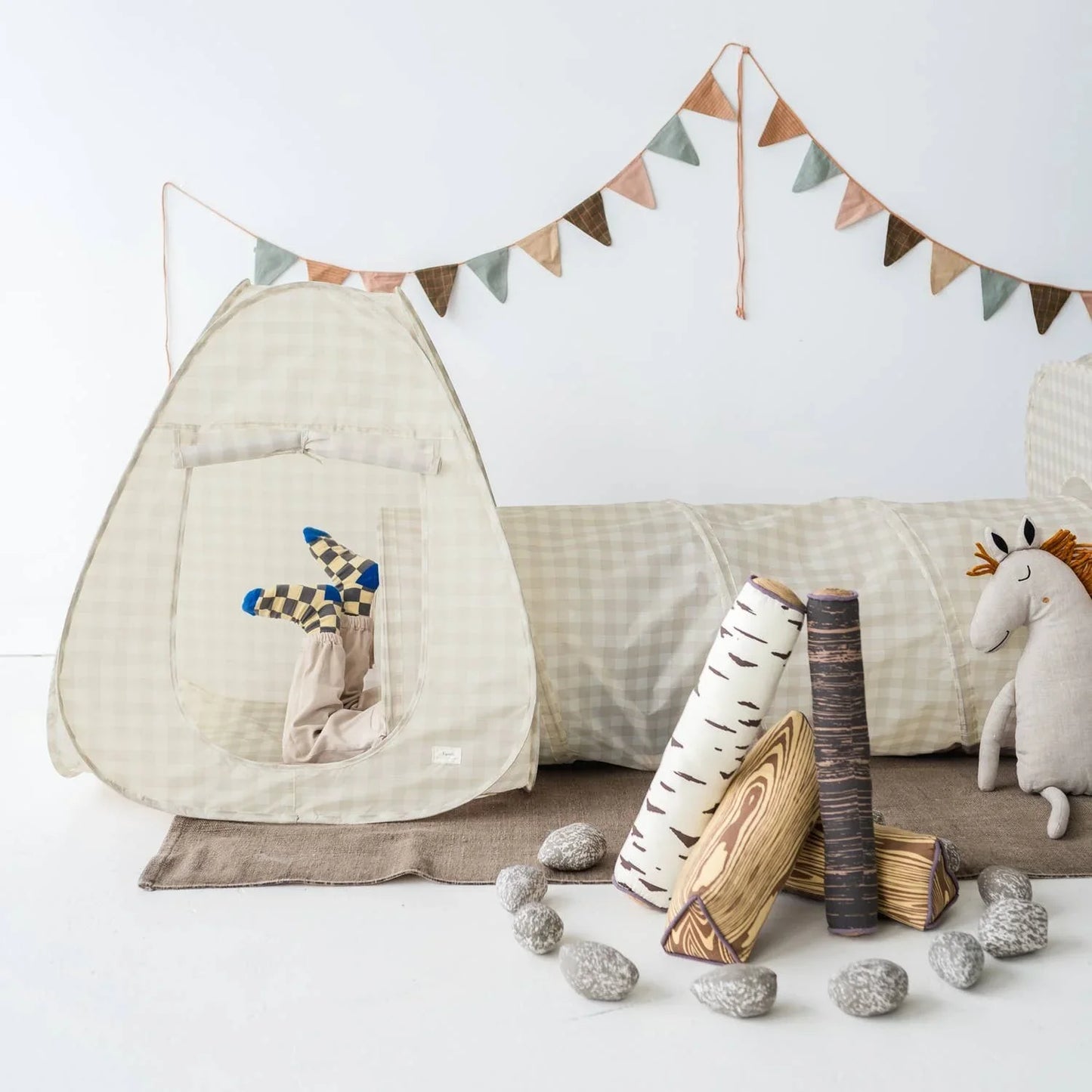 Child's play tent and tunnel set with woodland toys and fabric stones in neutral colors. Come see us at Awaken, Franklin, Tennessee