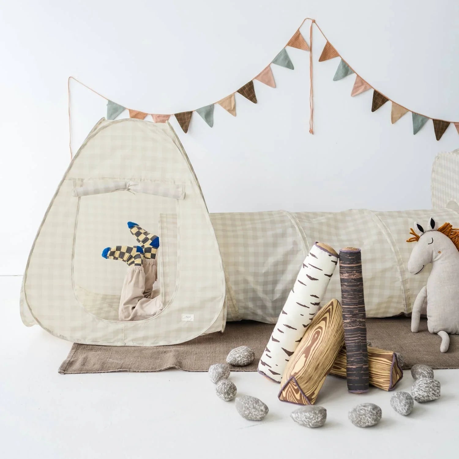 Child's play tent and tunnel set with woodland toys and fabric stones in neutral colors. Come see us at Awaken, Franklin, Tennessee