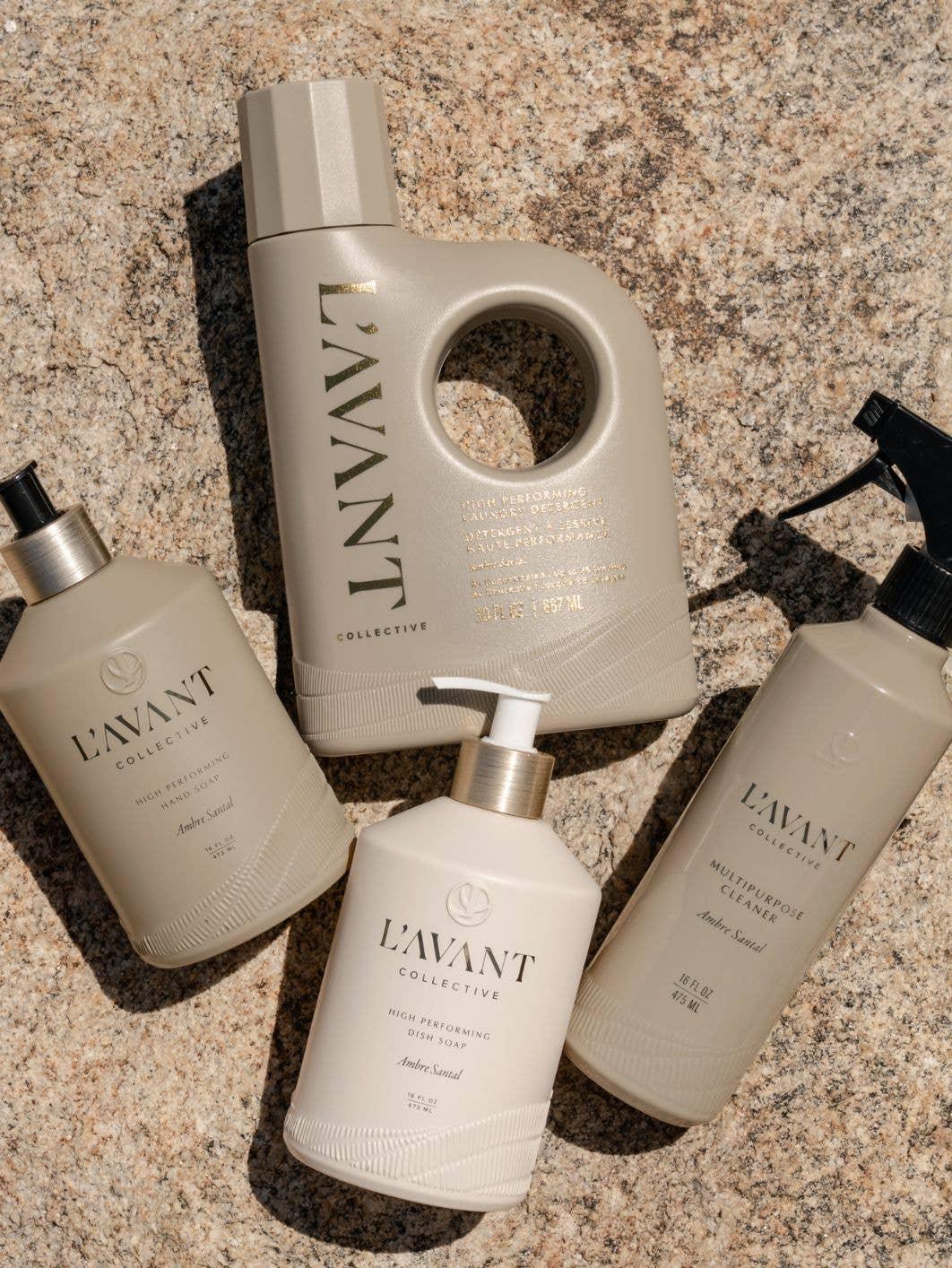 L'Avant Collective cleaning products on stone surface including hand soap, dish soap, detergent, and cleaner. Come see us at Awaken, Franklin, Tennessee