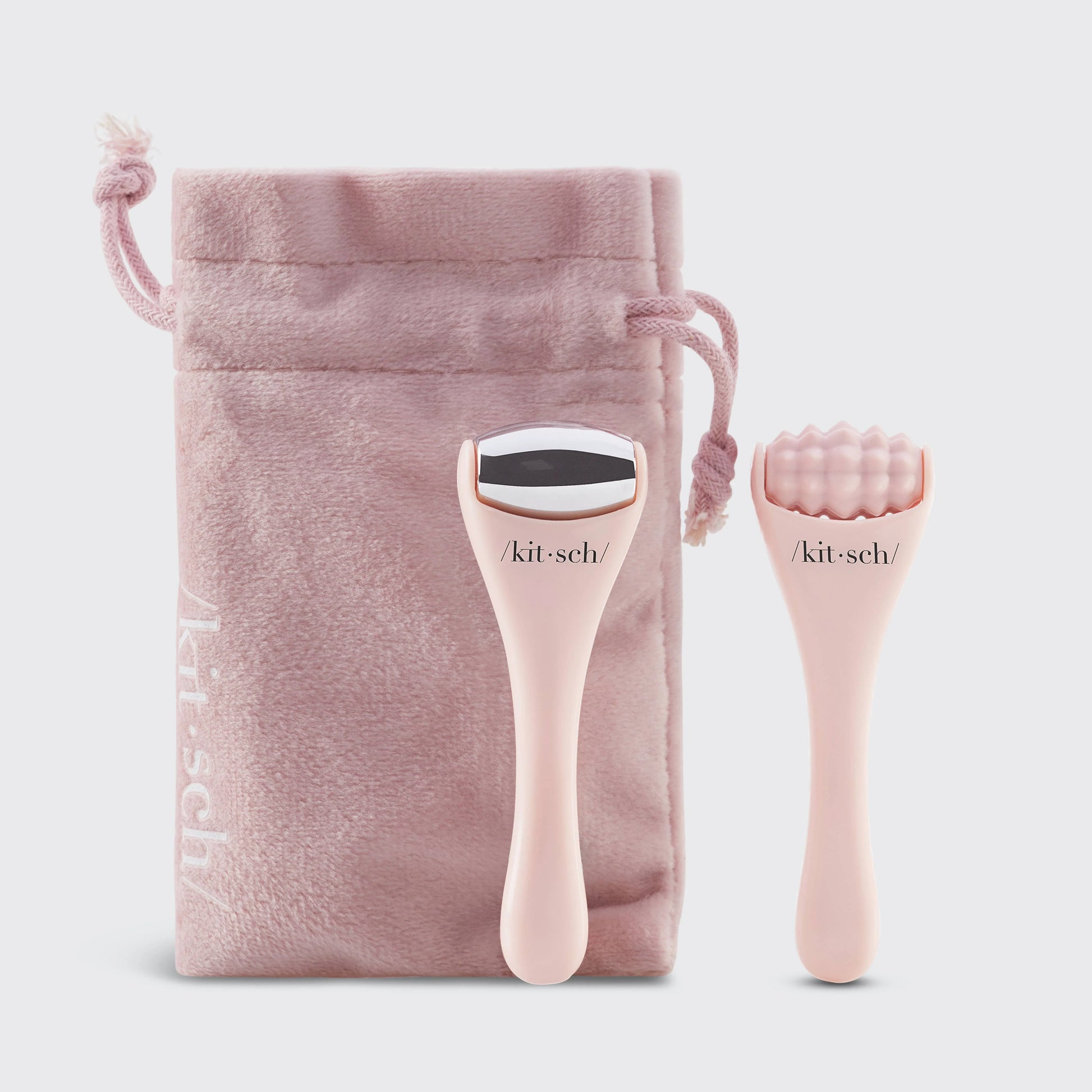 Pink Kitsch facial rollers with soft velvet pouch for skincare tool storage. Come see us at Awaken, Franklin, Tennessee