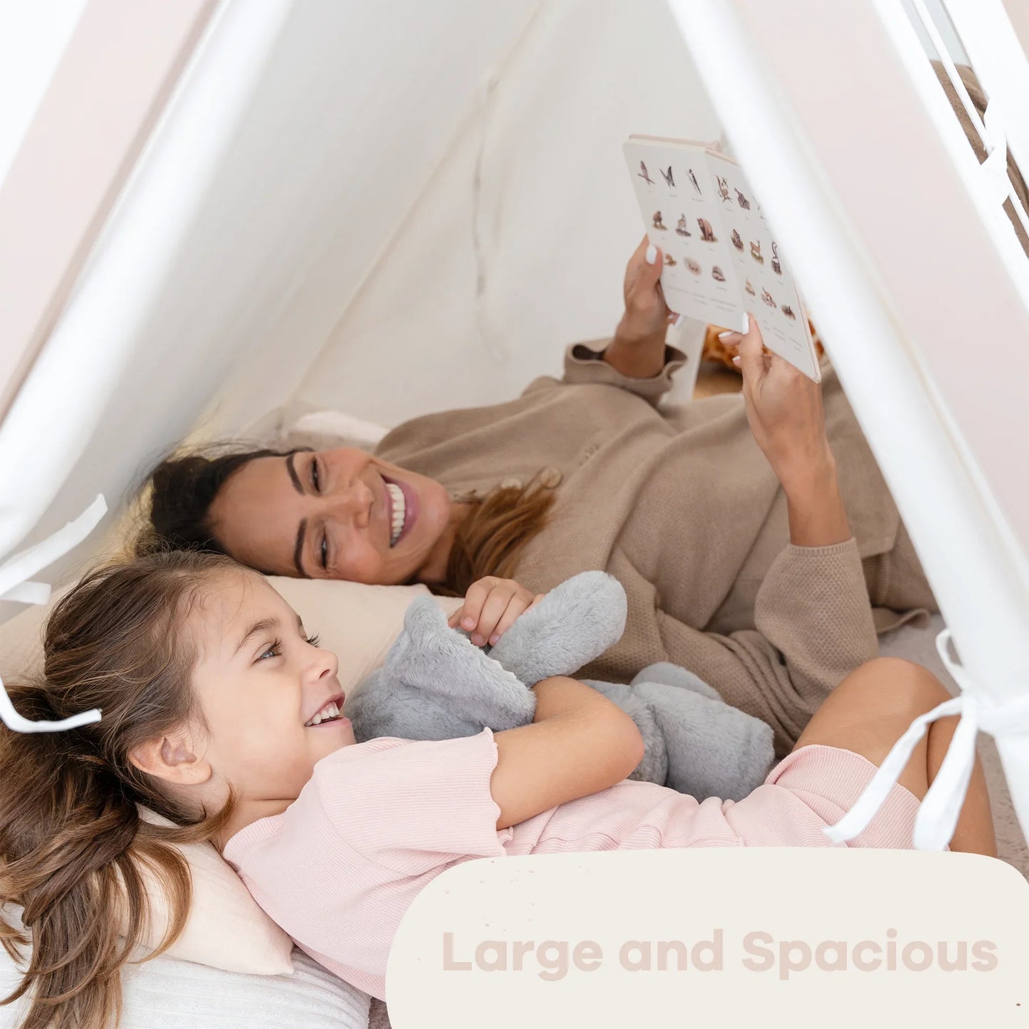 Mother and daughter reading in kids indoor tent, large and spacious. Come see us at Awaken, Franklin, Tennessee.