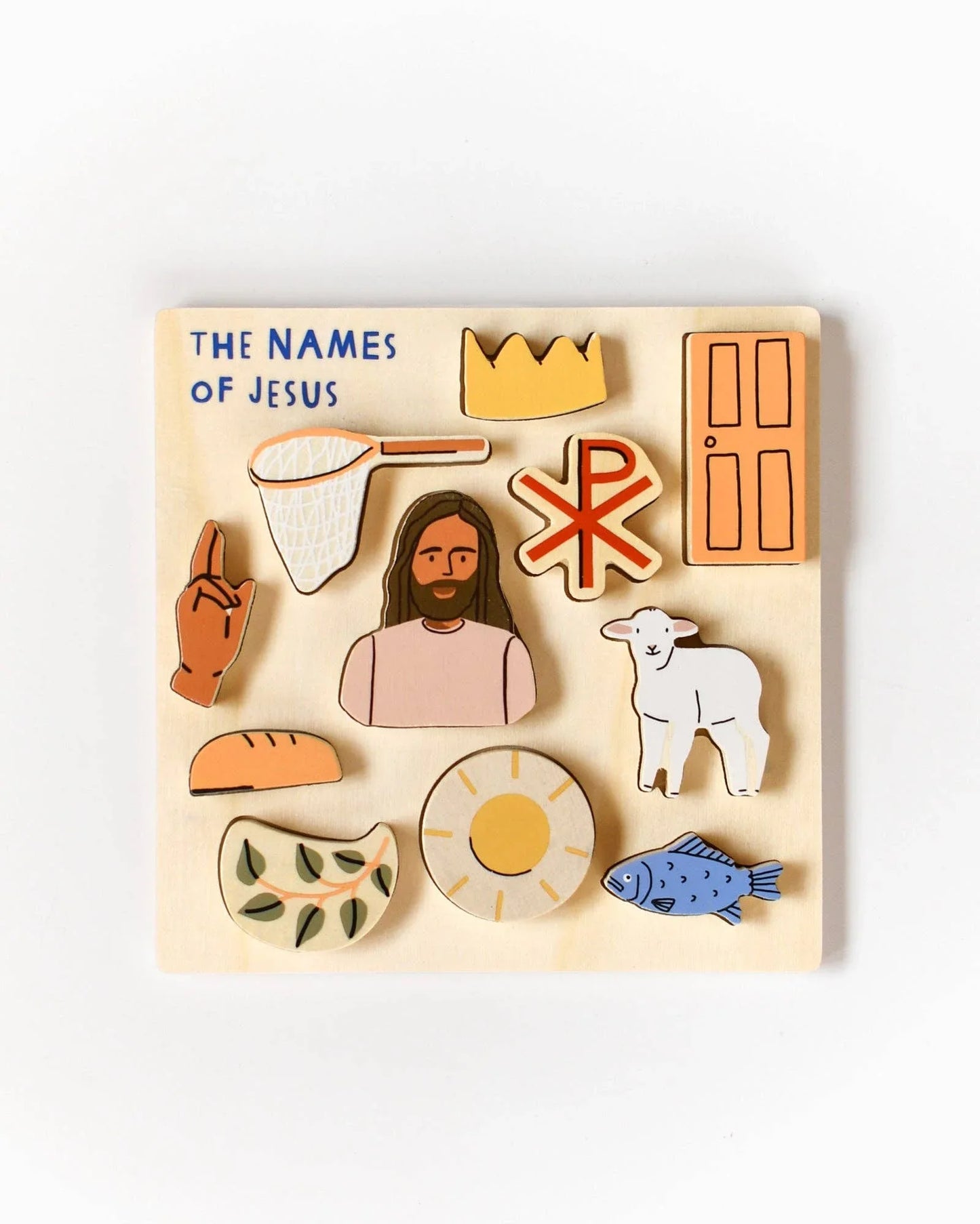 Wooden puzzle of Jesus with symbols and 'The Names of Jesus.' Come see us at Awaken, Franklin, Tennessee.