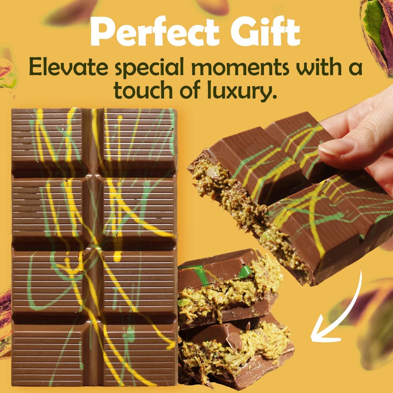 Chocolate bar with yellow and green drizzle, filled center, hand holding piece. Come see us at Awaken, Franklin, Tennessee.