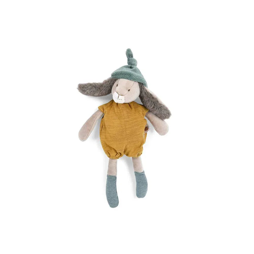 Plush bunny doll in mustard romper and green hat with long ears on white background. Come see us at Awaken, Franklin, Tennessee