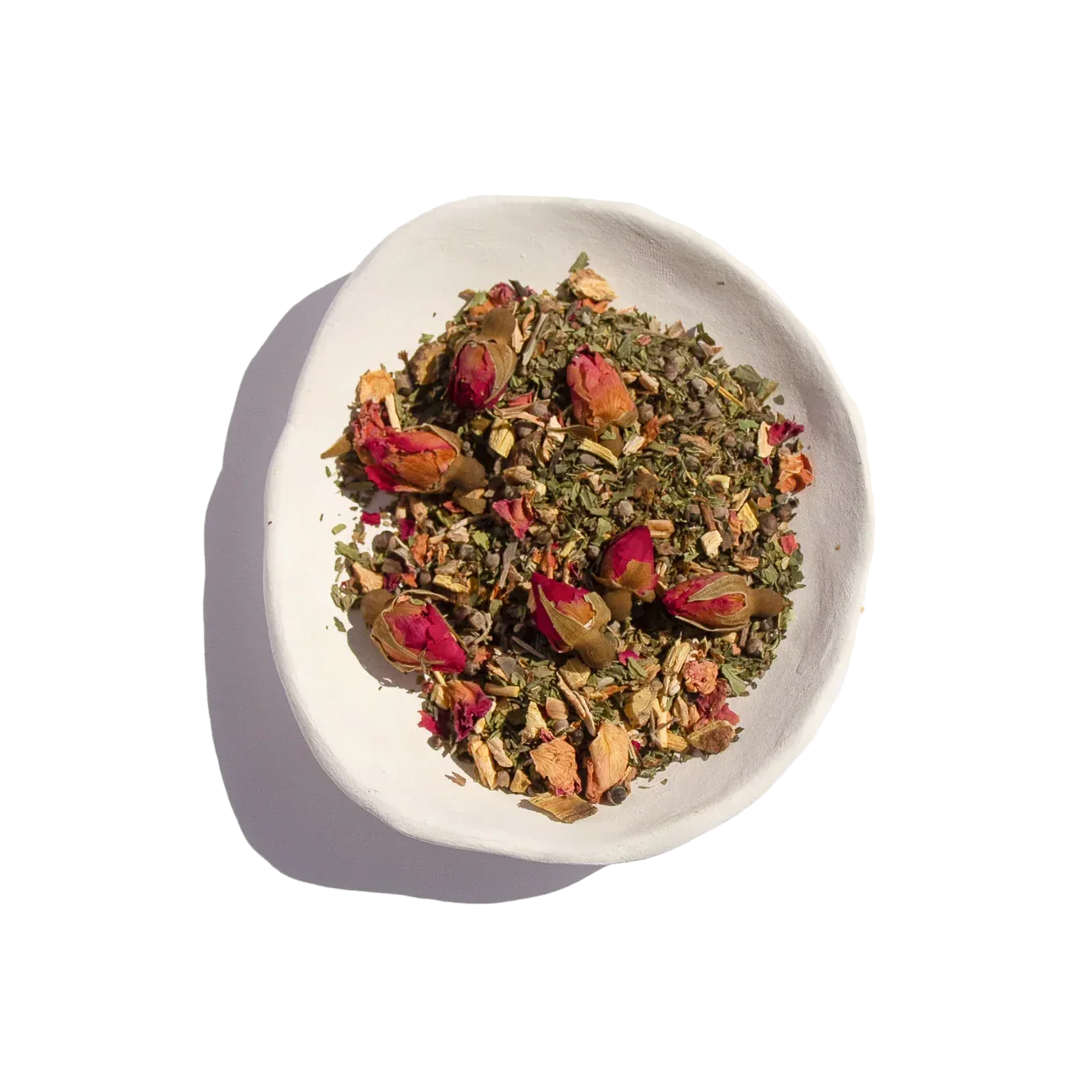 Dried herbal tea blend with rosebuds in white bowl on white background, Come see us at Awaken, Franklin, Tennessee