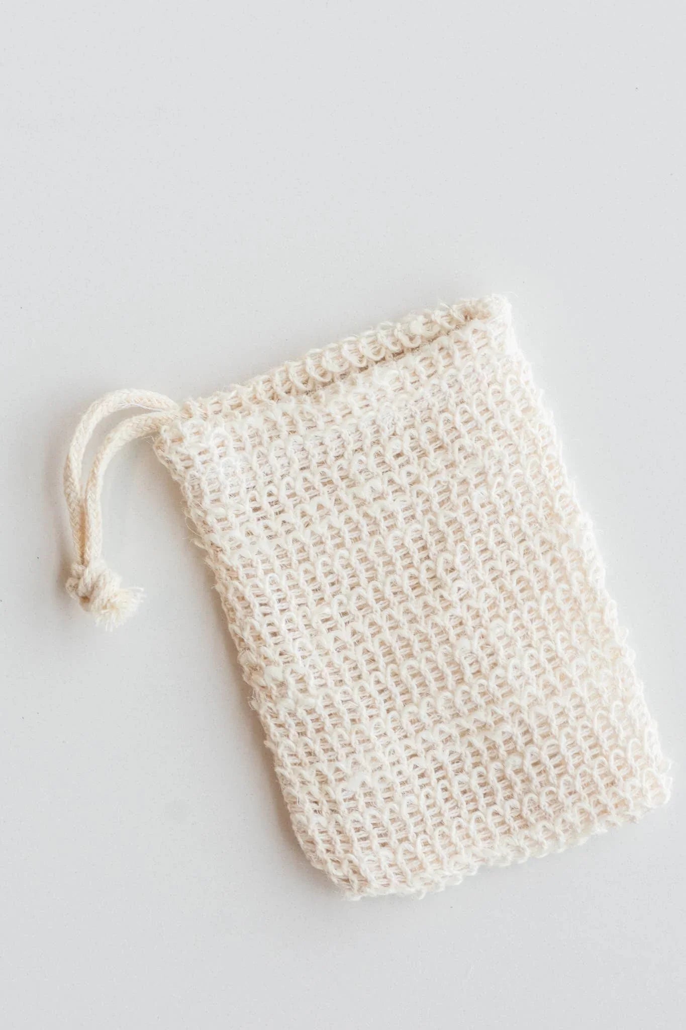 Natural woven drawstring soap pouch on white background. Come see us at Awaken, Franklin, Tennessee