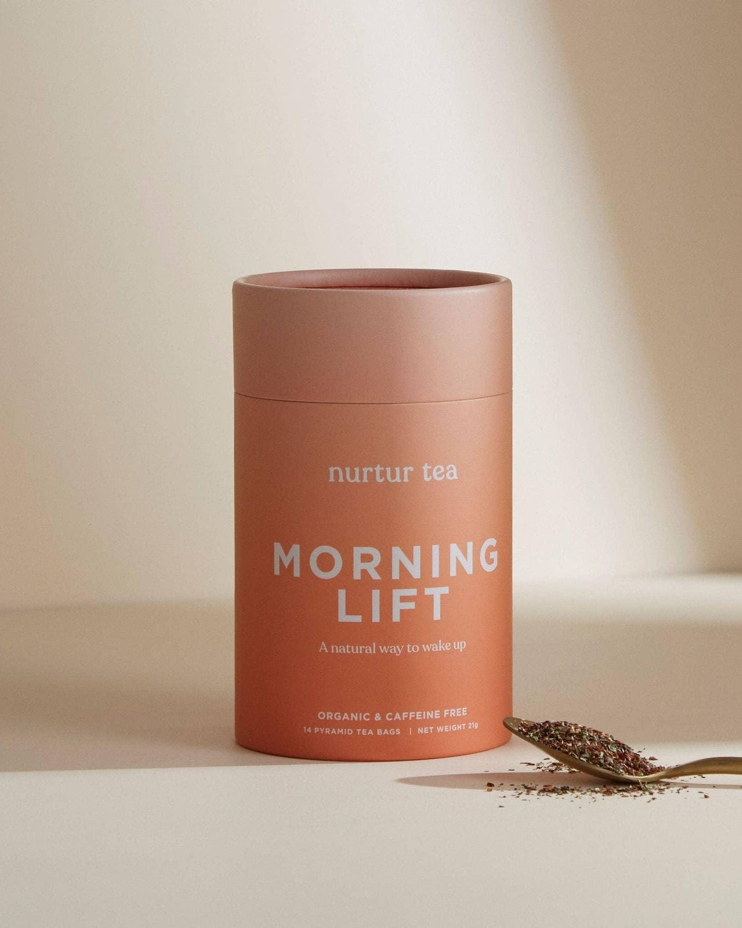 Nurtur Tea Morning Lift organic caffeine-free tea with loose tea on spoon, minimal design. Come see us at Awaken, Franklin, Tennessee