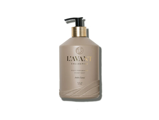 L'Avant Collective Ambre Santal high performing hand soap bottle with pump, beige with gold accents. Come see us at Awaken, Franklin, Tennessee