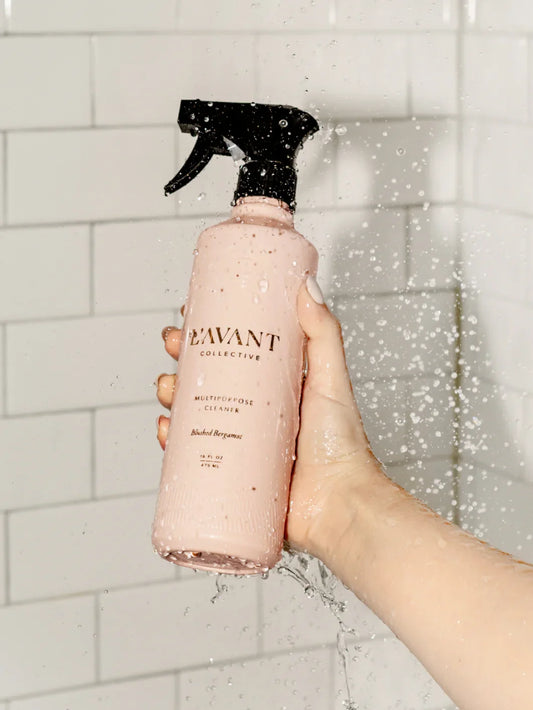 Hand holding EAVANT Collective multipurpose cleaner with water spray, Come see us at Awaken, Franklin, Tennessee