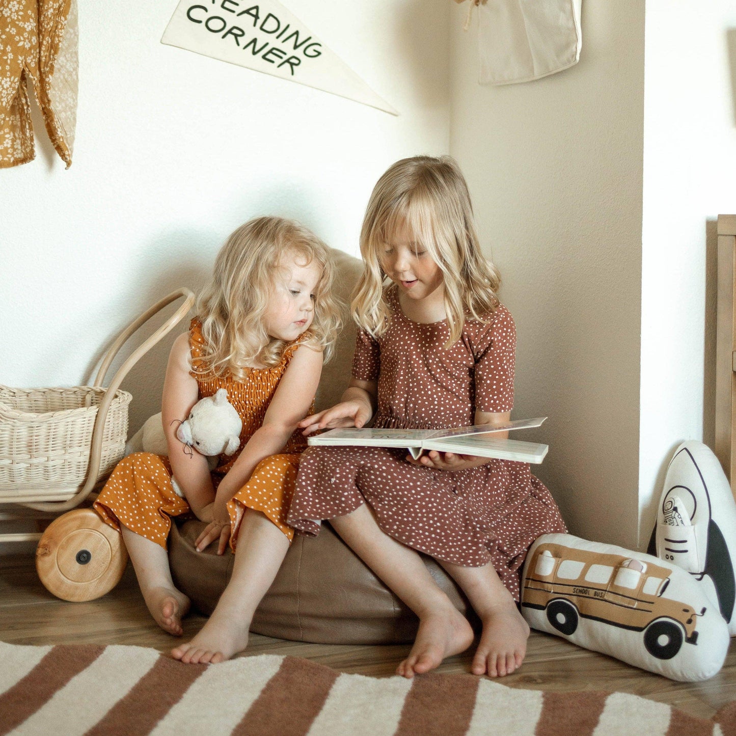 Two young girls reading in a cozy children's reading corner, Come see us at Awaken, Franklin, Tennessee