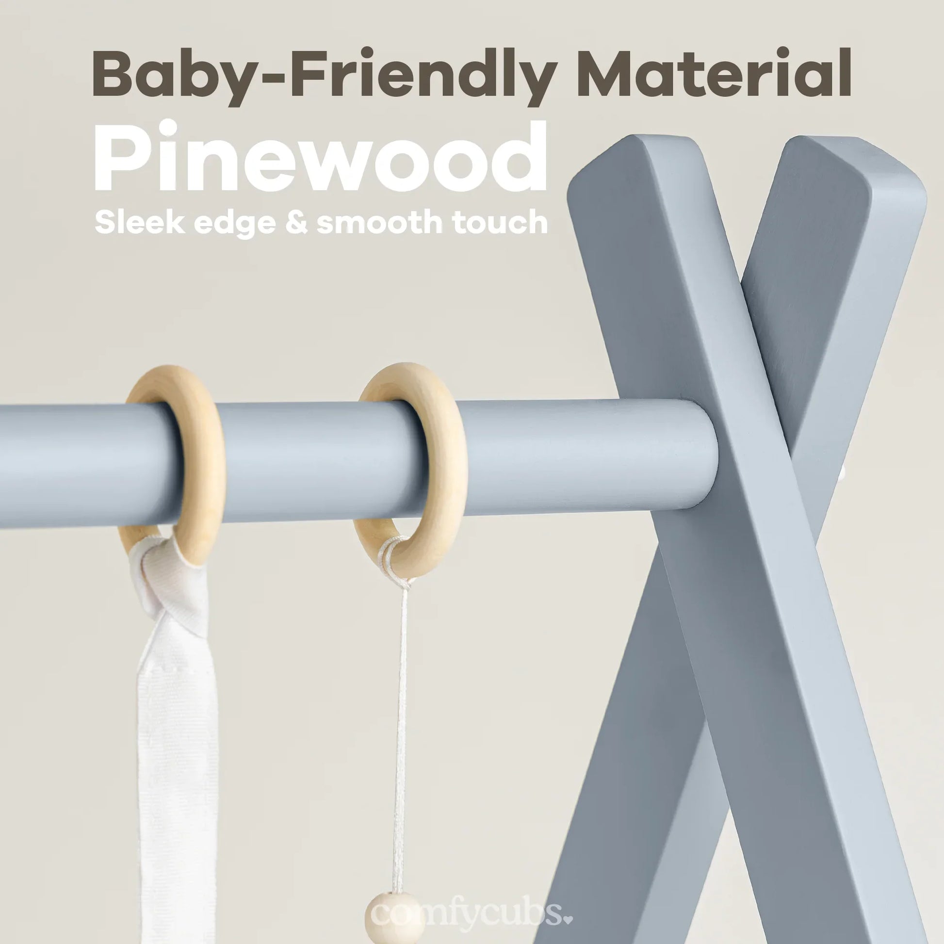 Baby-friendly pinewood play gym with sleek blue frame and wooden rings, soft touch finish. Come see us at Awaken, Franklin, Tennessee