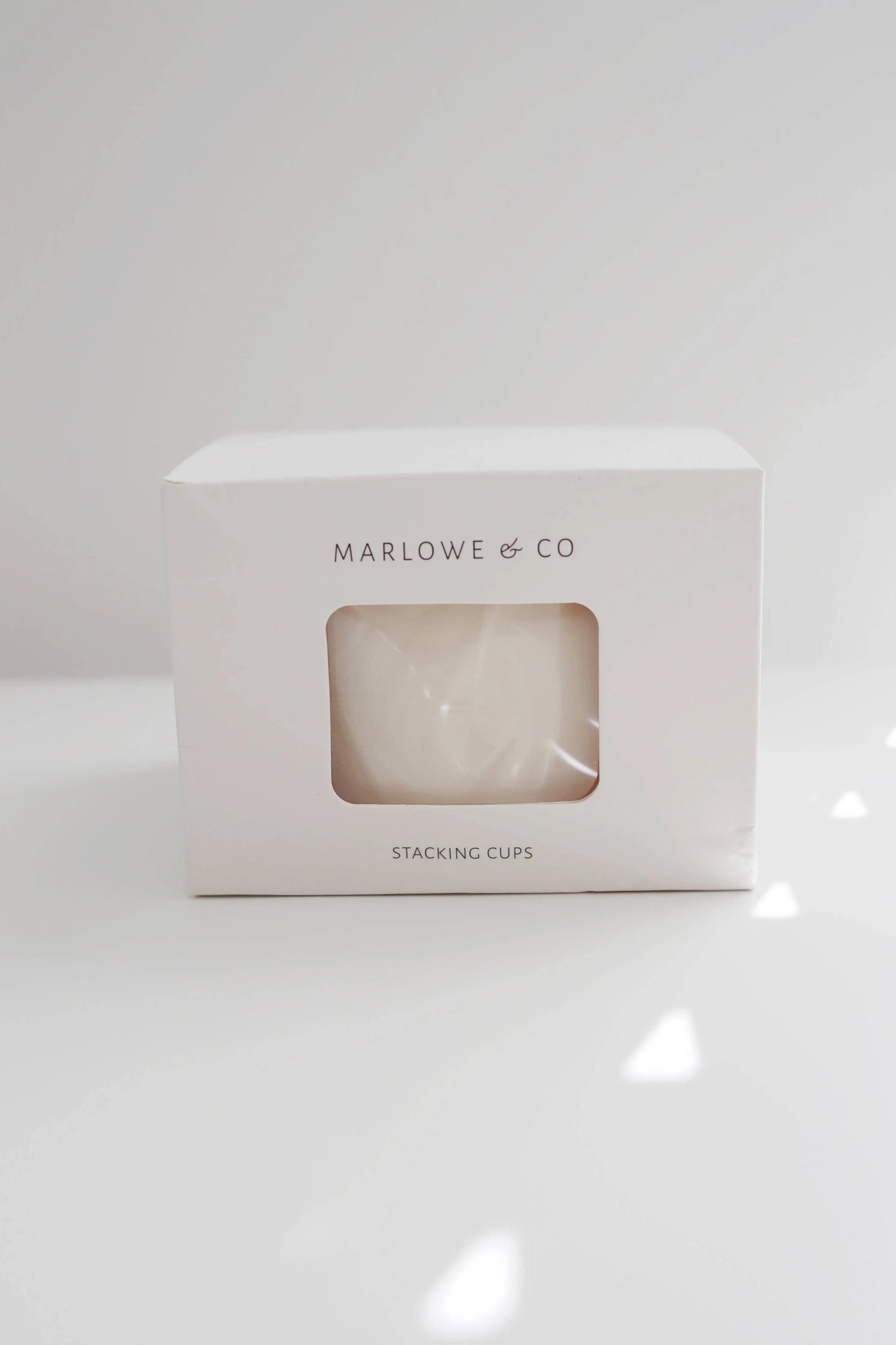 Marlowe & Co stacking cups in white packaging on white surface with soft light. Come see us at Awaken, Franklin, Tennessee
