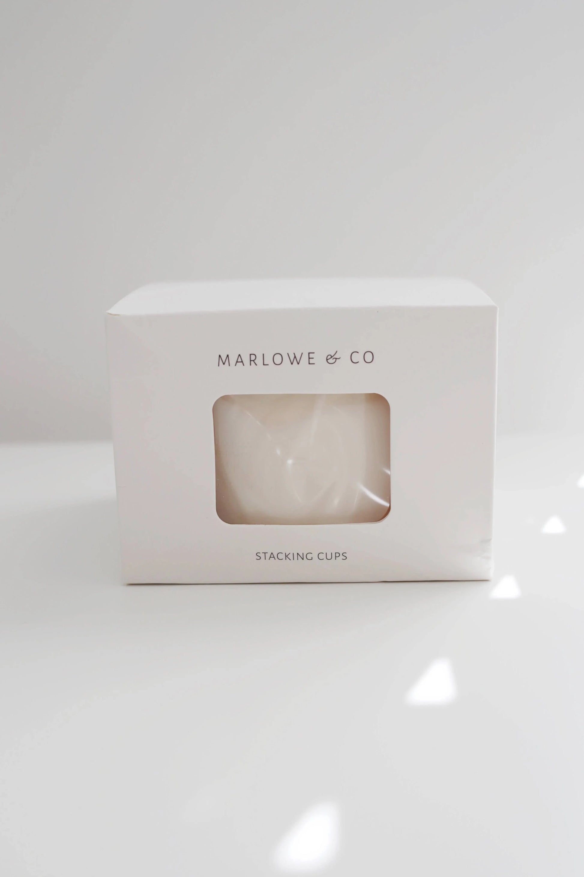 Marlowe & Co stacking cups in white packaging on white surface with soft light. Come see us at Awaken, Franklin, Tennessee