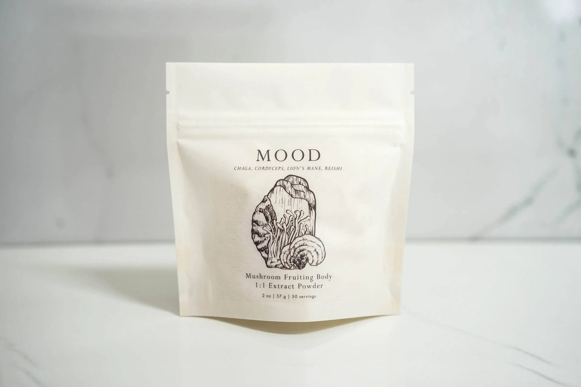 MOOD mushroom extract powder package on white surface with marble background Come see us at Awaken, Franklin, Tennessee