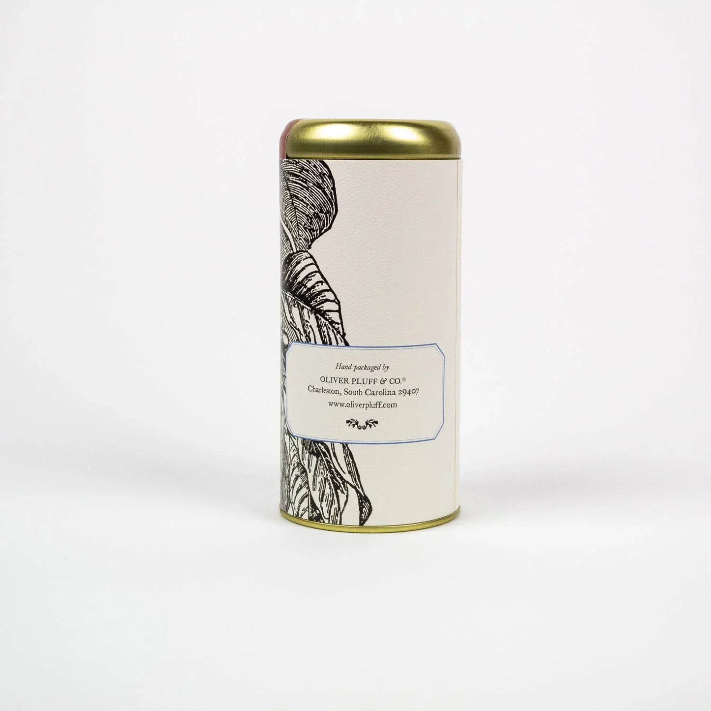 Tin container with botanical design and Oliver Pluff & Co. label on white background. Come see us at Awaken, Franklin, Tennessee