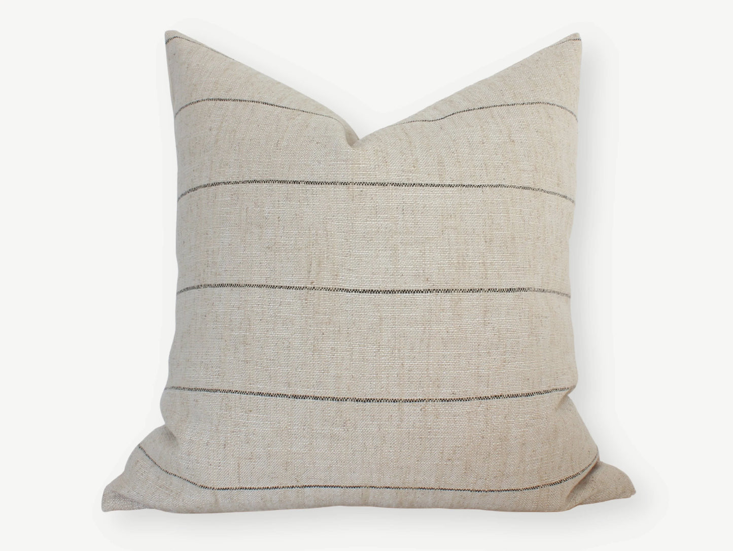 Beige lumbar pillow with thin black horizontal stripes on white background. Come see us at Awaken, Franklin, Tennessee