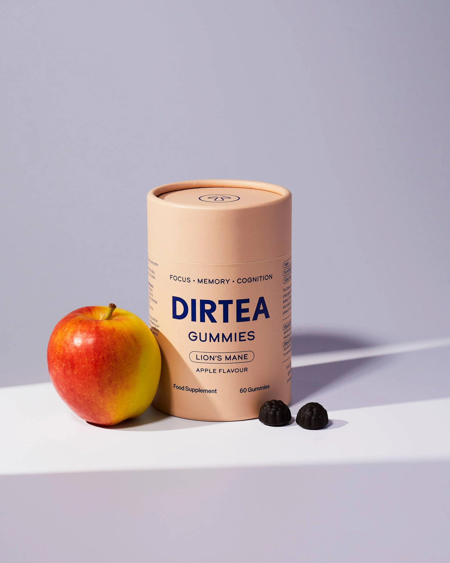 DIRTEA Lion's Mane apple gummies with apple on white surface, Come see us at Awaken, Franklin, Tennessee