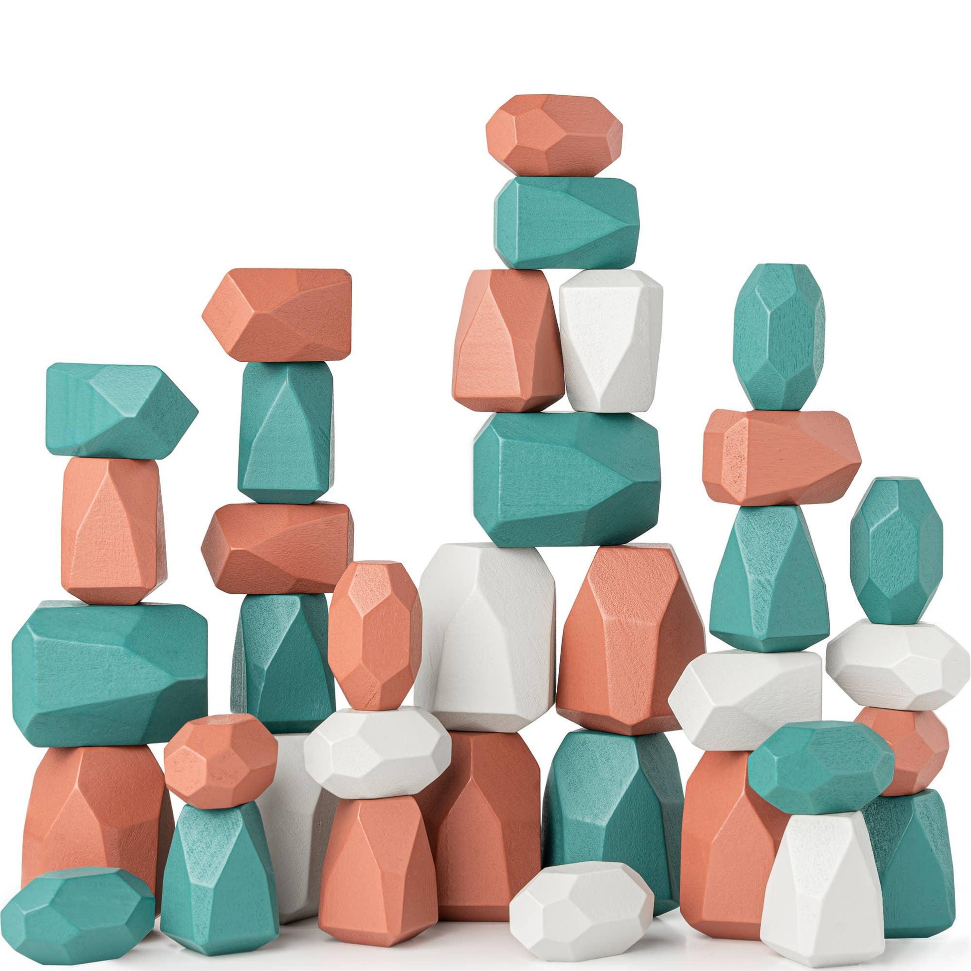 Colorful geometric wooden stacking blocks in teal, white, and peach colors. Come see us at Awaken, Franklin, Tennessee