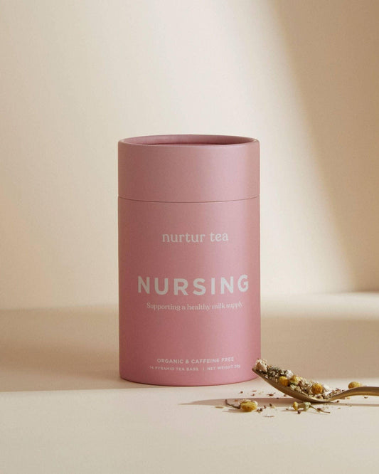 Nurtur Tea Nursing pink canister and herbal tea on spoon, organic caffeine free, Come see us at Awaken, Franklin, Tennessee