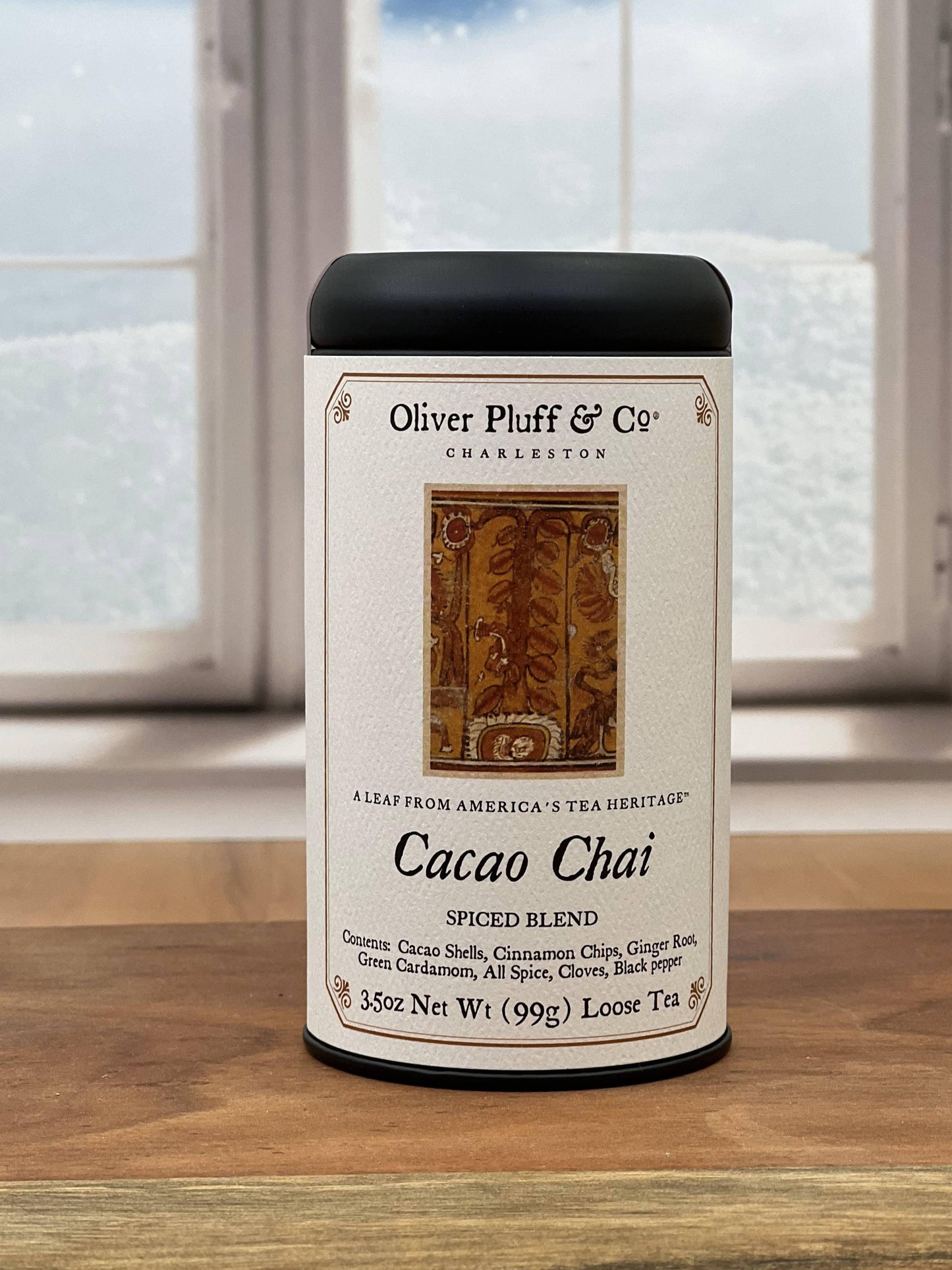 Oliver Pluff & Co Cacao Chai spiced blend loose tea in a white canister on wooden surface Come see us at Awaken, Franklin, Tennessee
