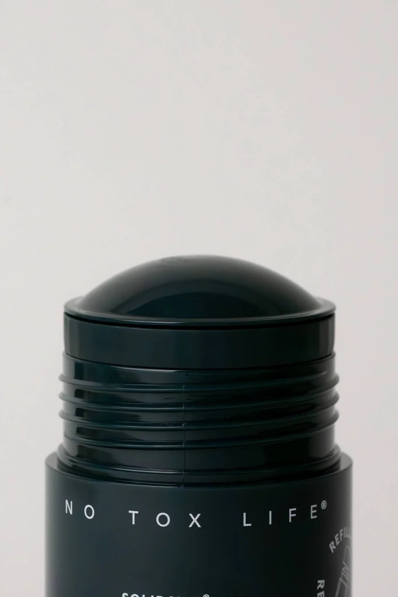 Black No Tox Life solid deodorant stick with rounded cap, minimal design. Come see us at Awaken, Franklin, Tennessee