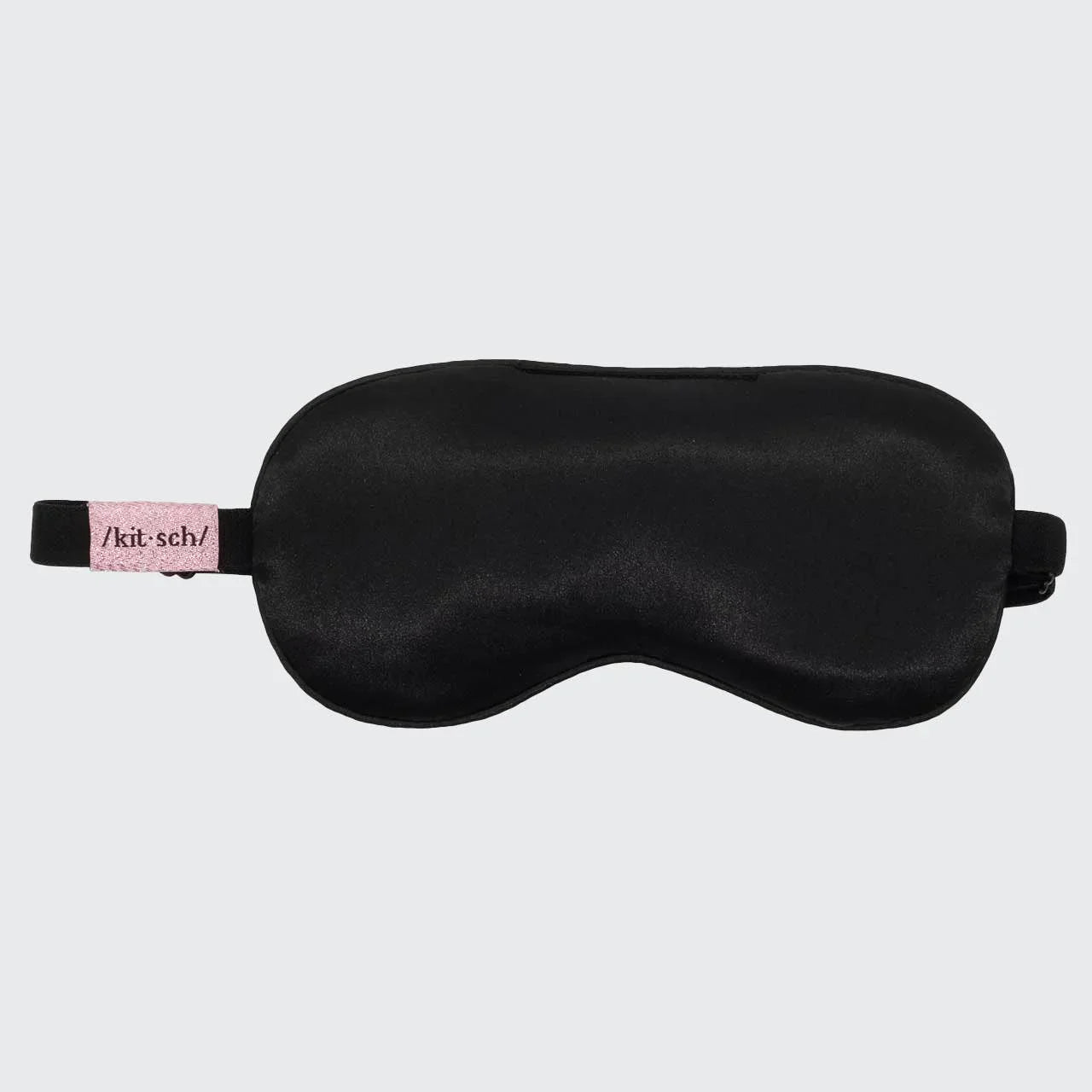 Black satin sleep mask with pink Kitsch label, Come see us at Awaken, Franklin, Tennessee