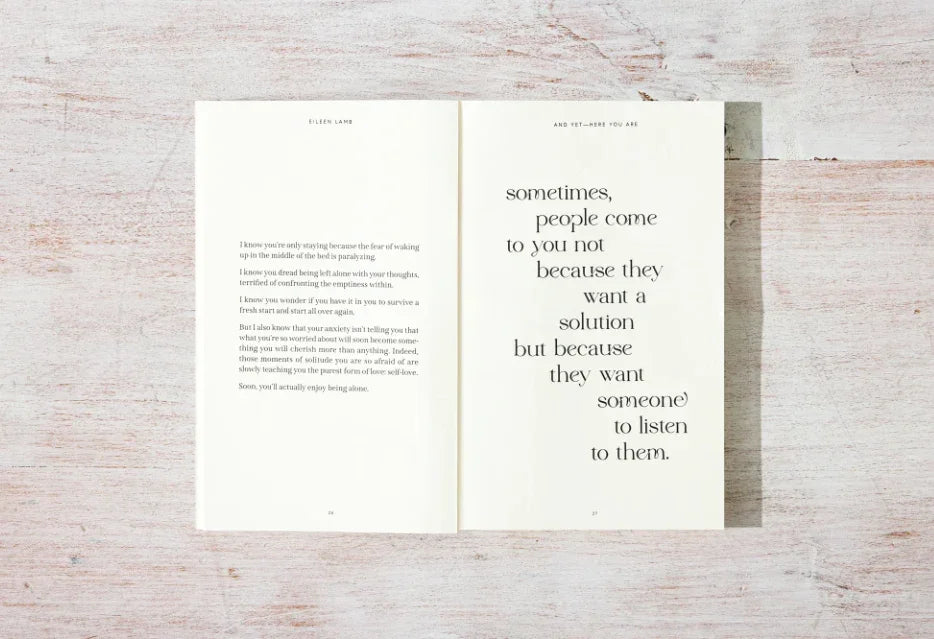 Open book on white wooden table with reflective text about anxiety and listening. Come see us at Awaken, Franklin, Tennessee.