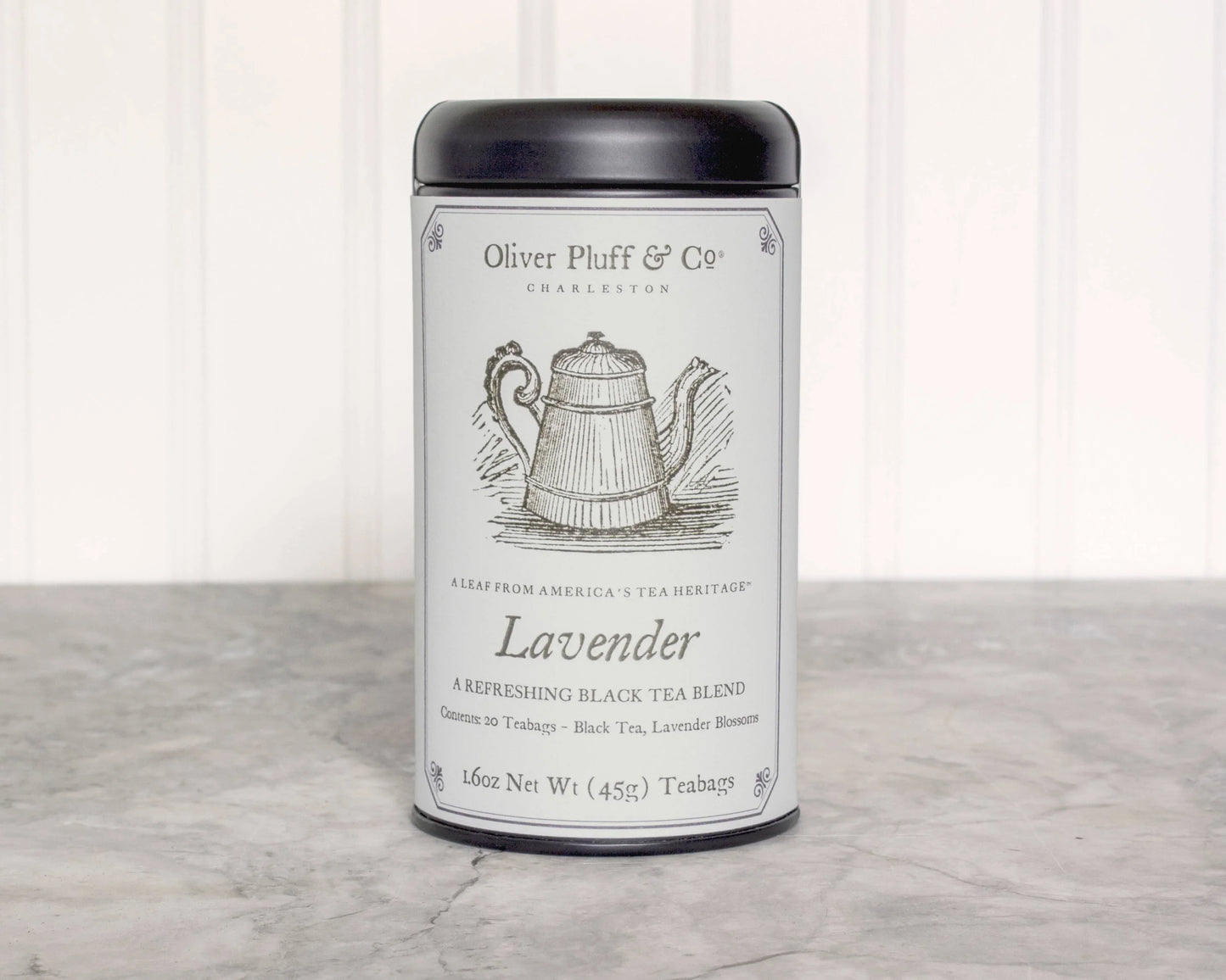 Oliver Pluff & Co Lavender black tea blend tin on marble countertop. Come see us at Awaken, Franklin, Tennessee