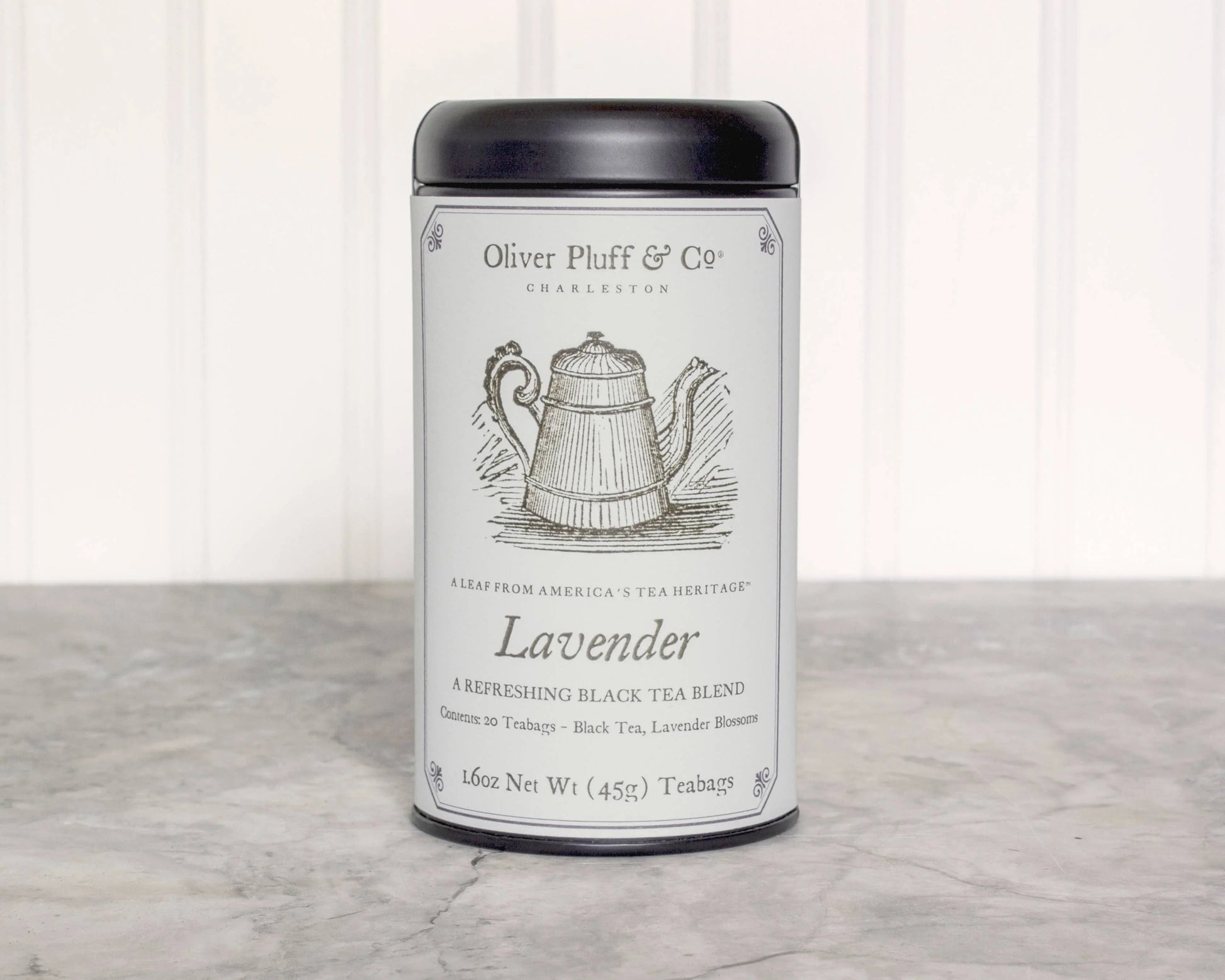 Oliver Pluff & Co Lavender black tea blend tin on marble countertop. Come see us at Awaken, Franklin, Tennessee